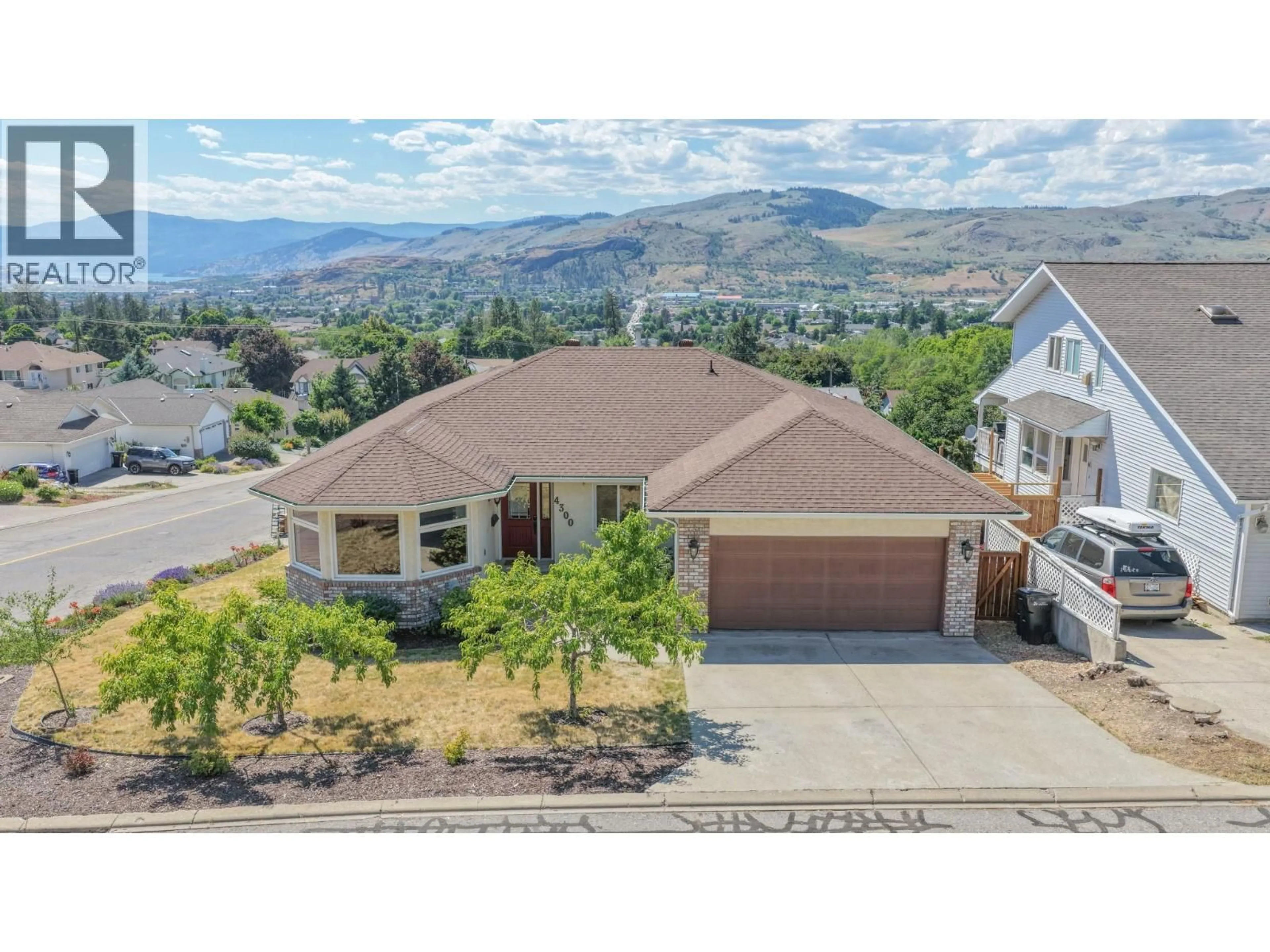 A pic from outside/outdoor area/front of a property/back of a property/a pic from drone, mountain view for 4300 WELLINGTON DRIVE, Vernon British Columbia V1T8W3