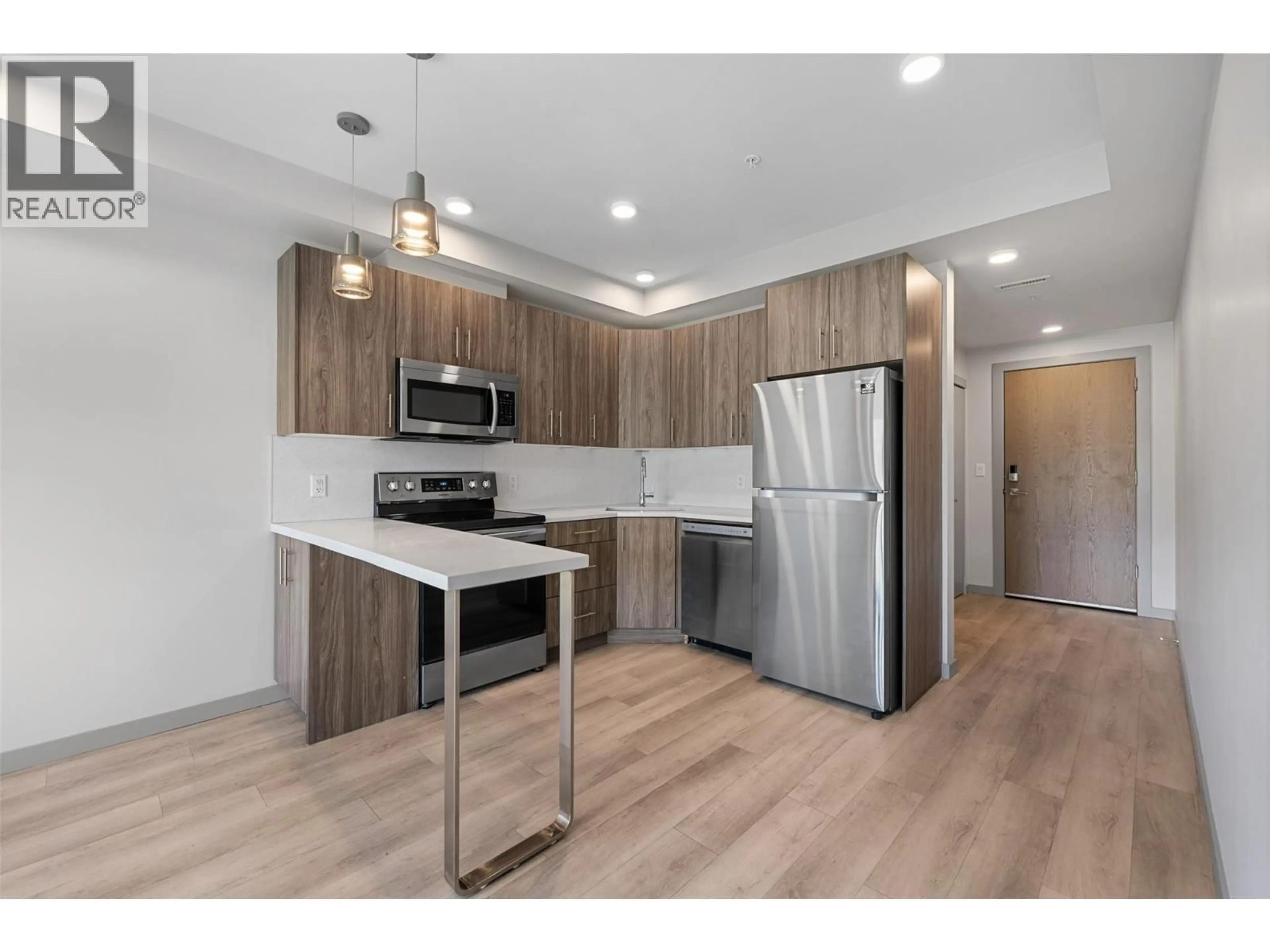 Standard kitchen, wood/laminate floor for 325 - 345 DOUGALL ROAD, Kelowna British Columbia V1X0A8