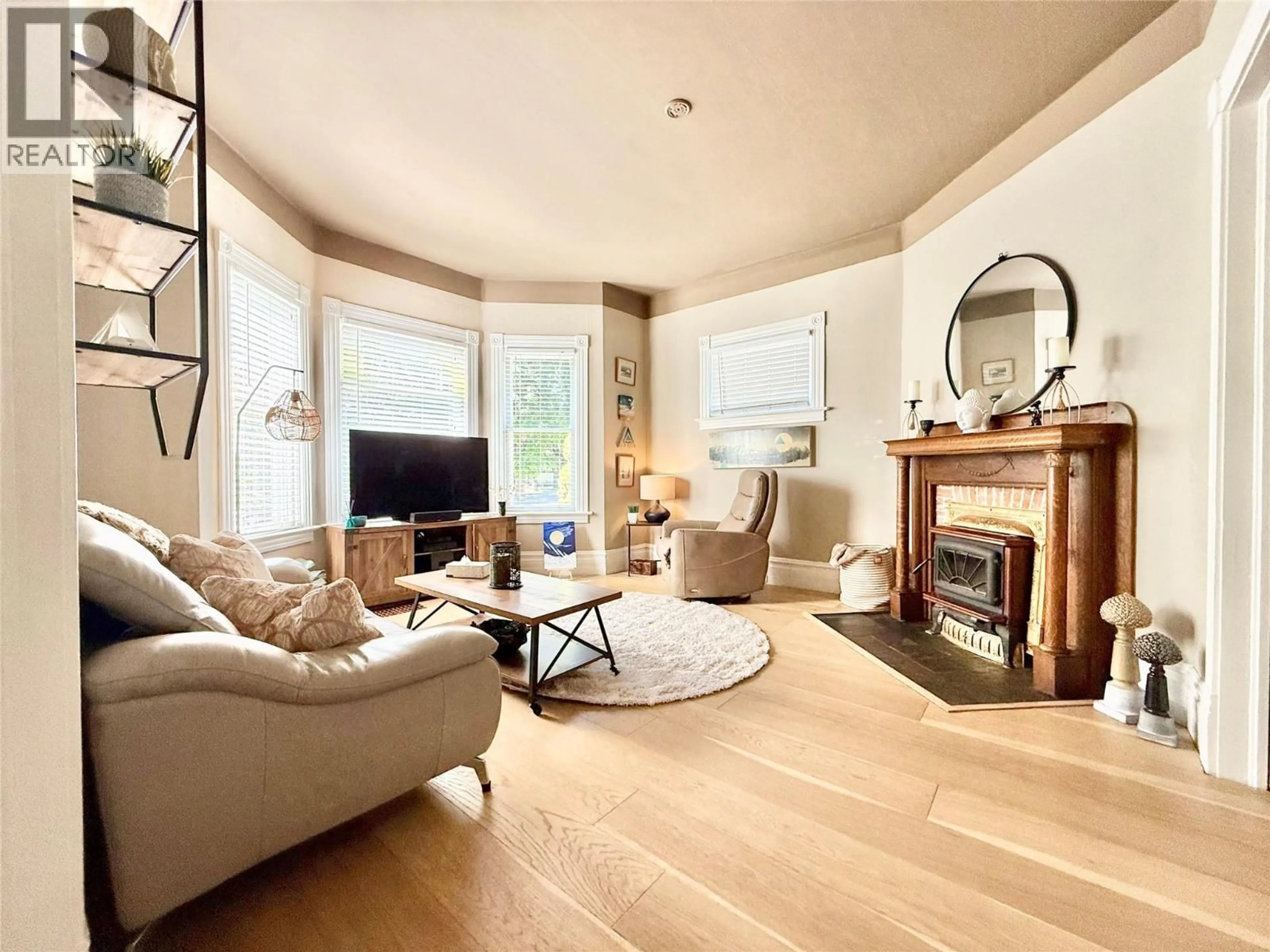 Living room with furniture, wood/laminate floor for 825 CENTRAL AVENUE, Grand Forks British Columbia V0H1H0