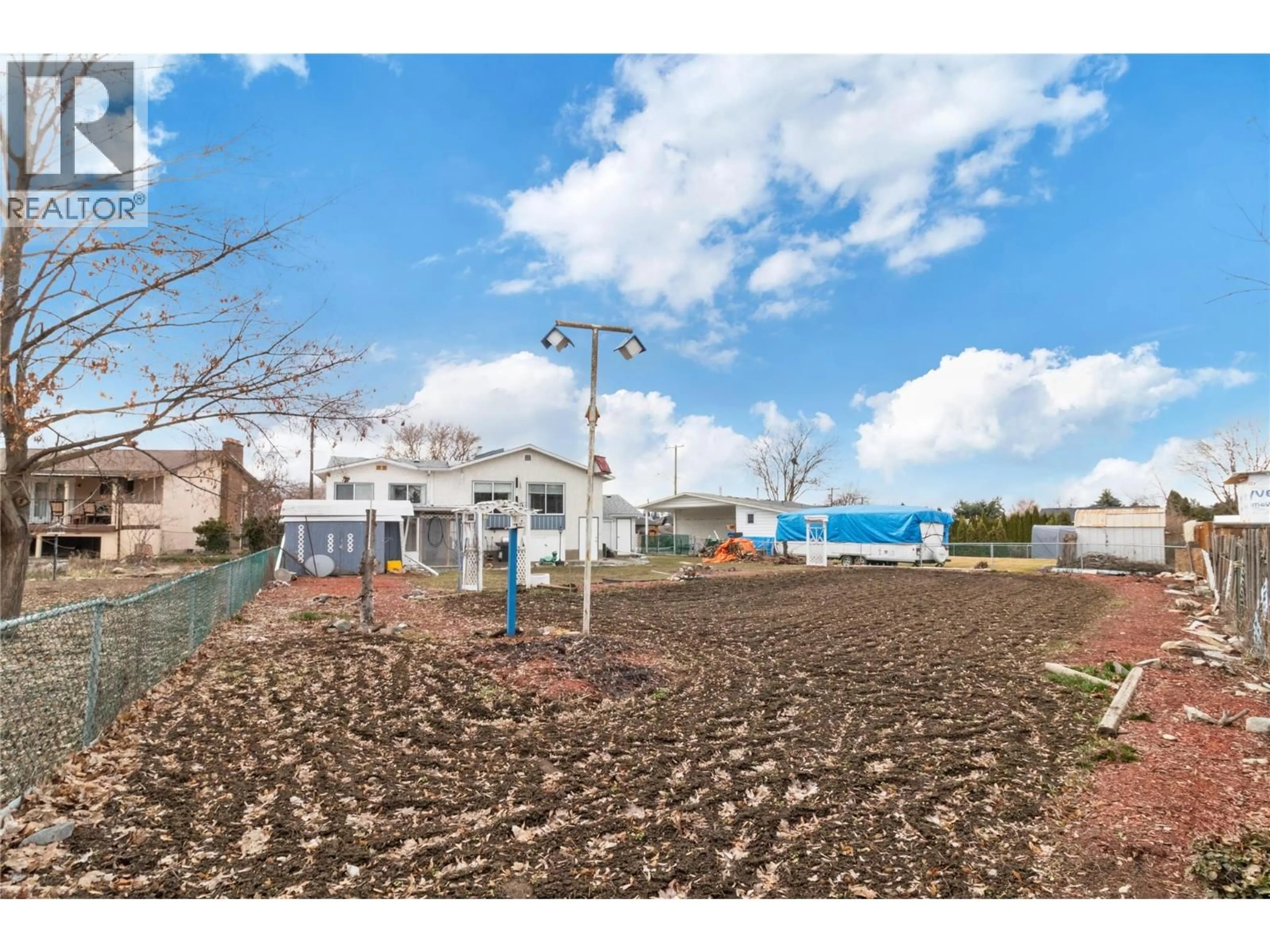A pic from outside/outdoor area/front of a property/back of a property/a pic from drone, street for 750 FALKIRK ROAD, Kelowna British Columbia V1X1R1