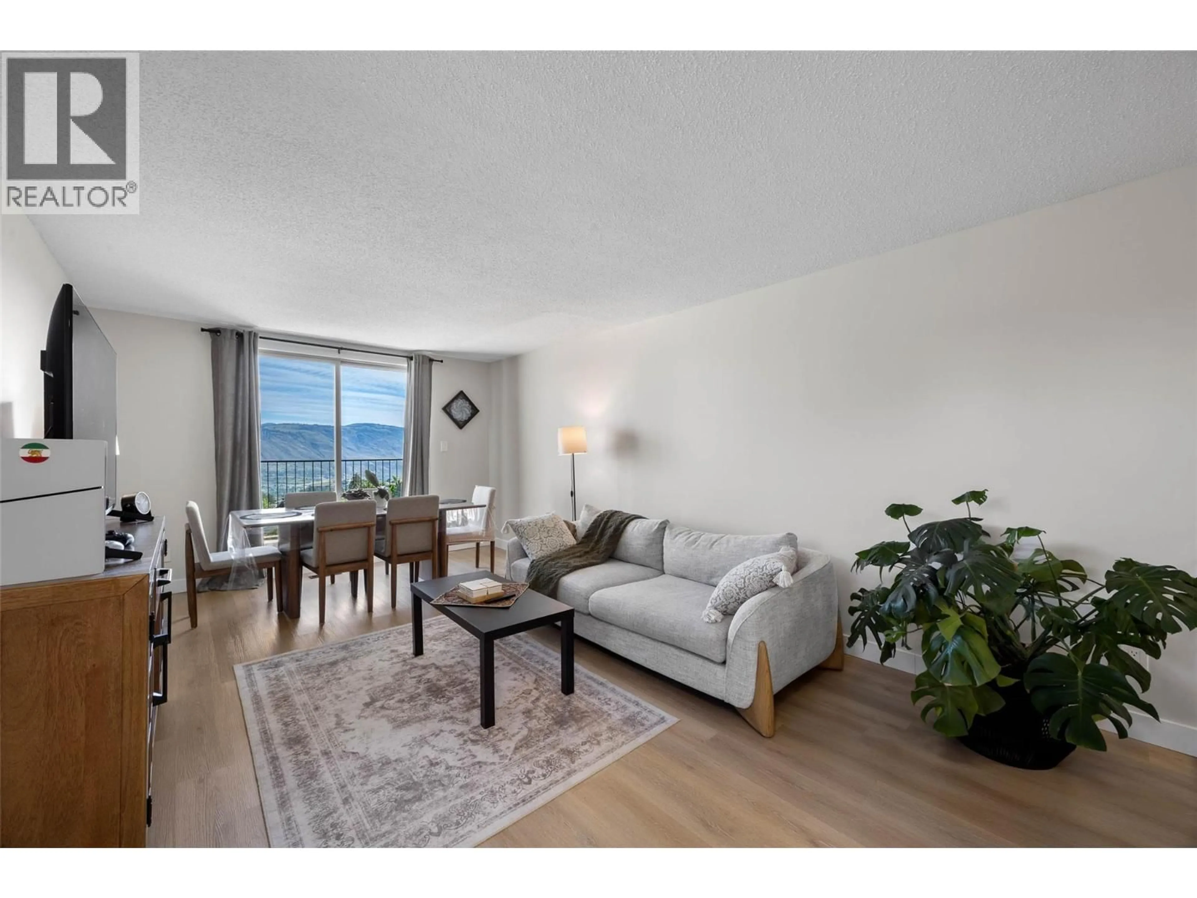 Living room with furniture, wood/laminate floor for 32 - 1750 SUMMIT DRIVE, Kamloops British Columbia V2E1Y1