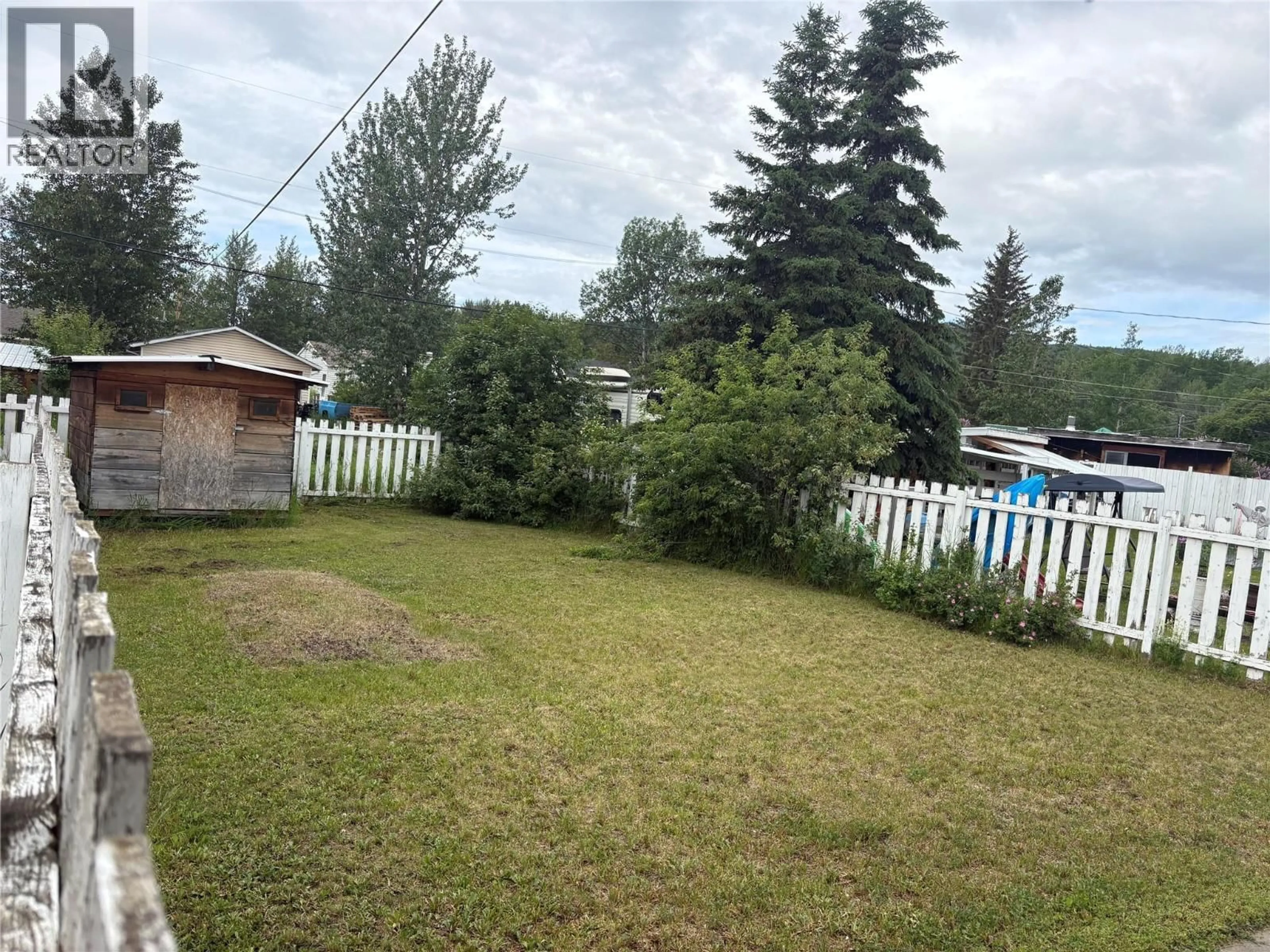 A pic from outside/outdoor area/front of a property/back of a property/a pic from drone, mountain view for 4725 52 STREET NORTHWEST, Chetwynd British Columbia V0C1J0