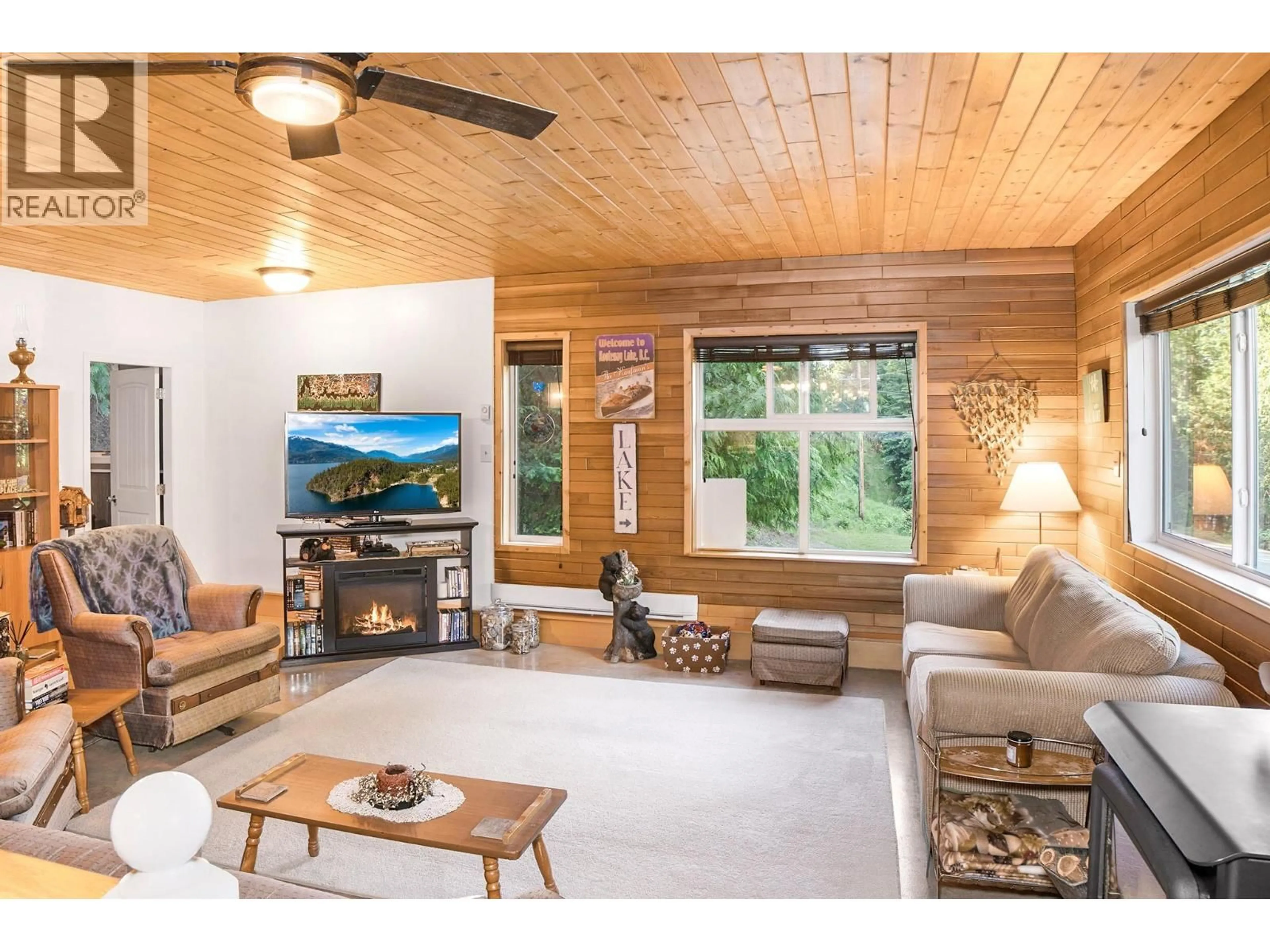 Living room with furniture, wood/laminate floor for 12806 3A HIGHWAY, Boswell British Columbia V0B1A0