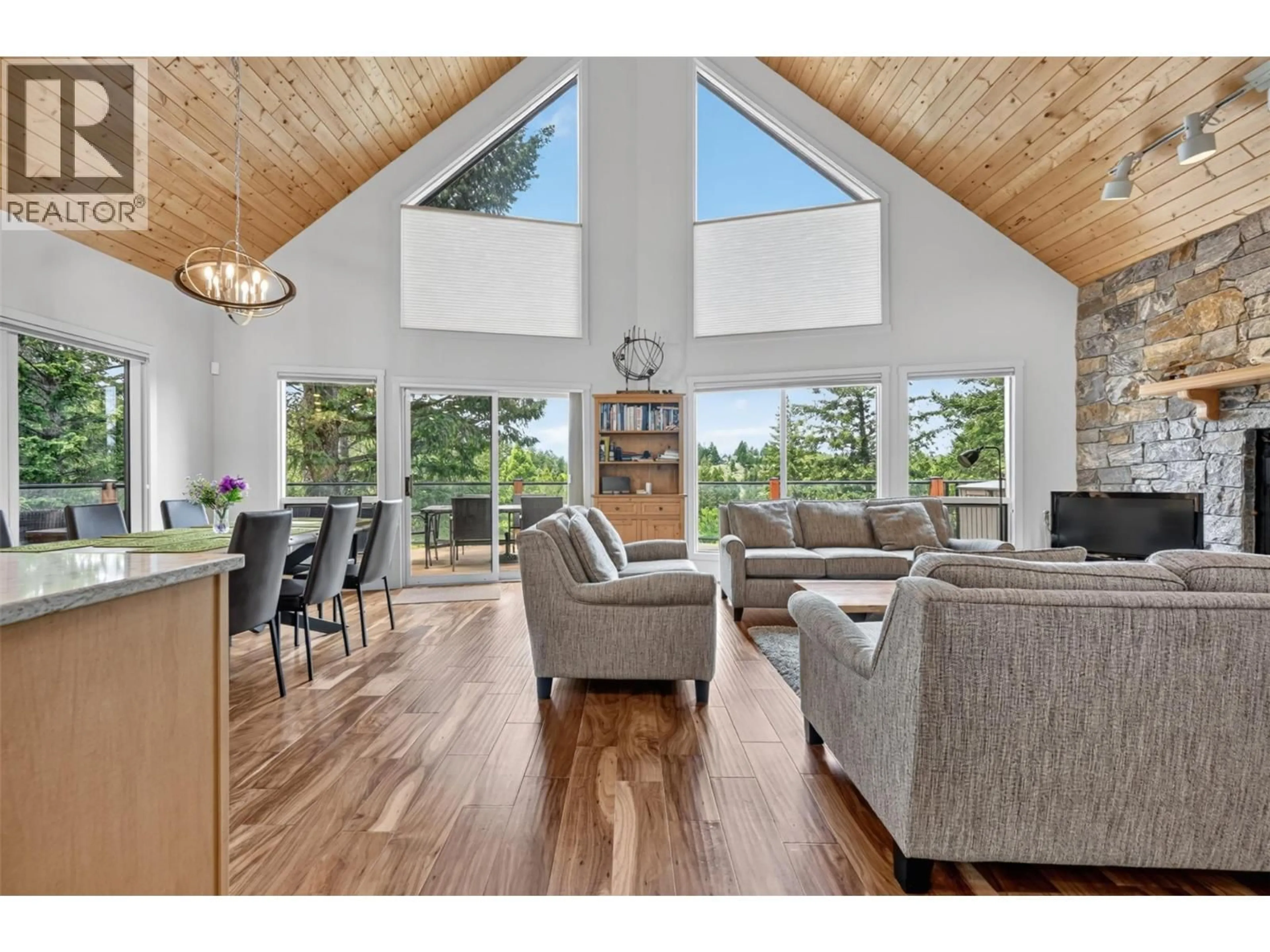 Living room with furniture, wood/laminate floor for 4933 MERLO ROAD, Windermere British Columbia V0A1K3