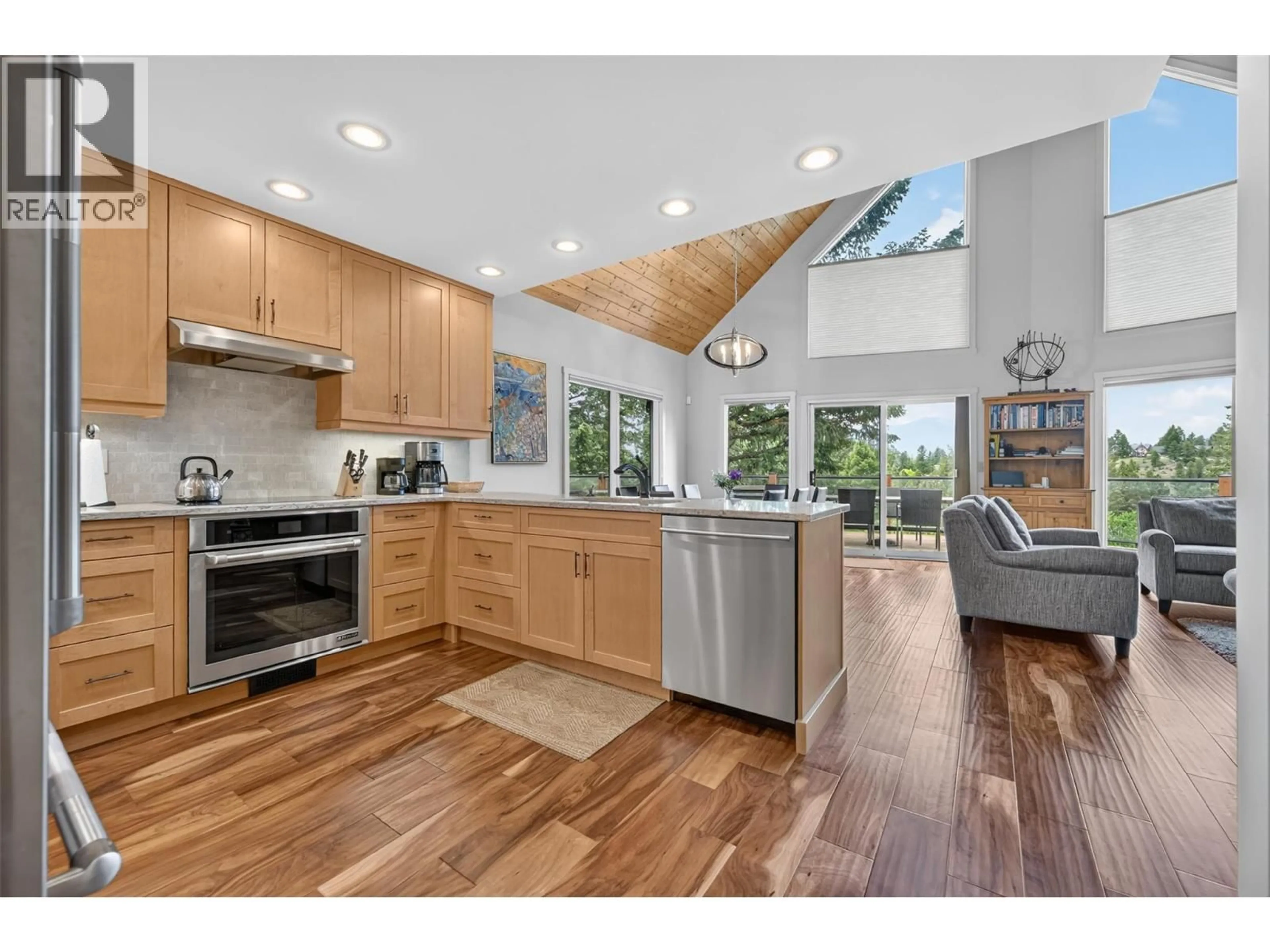 Open concept kitchen, wood/laminate floor for 4933 MERLO ROAD, Windermere British Columbia V0A1K3