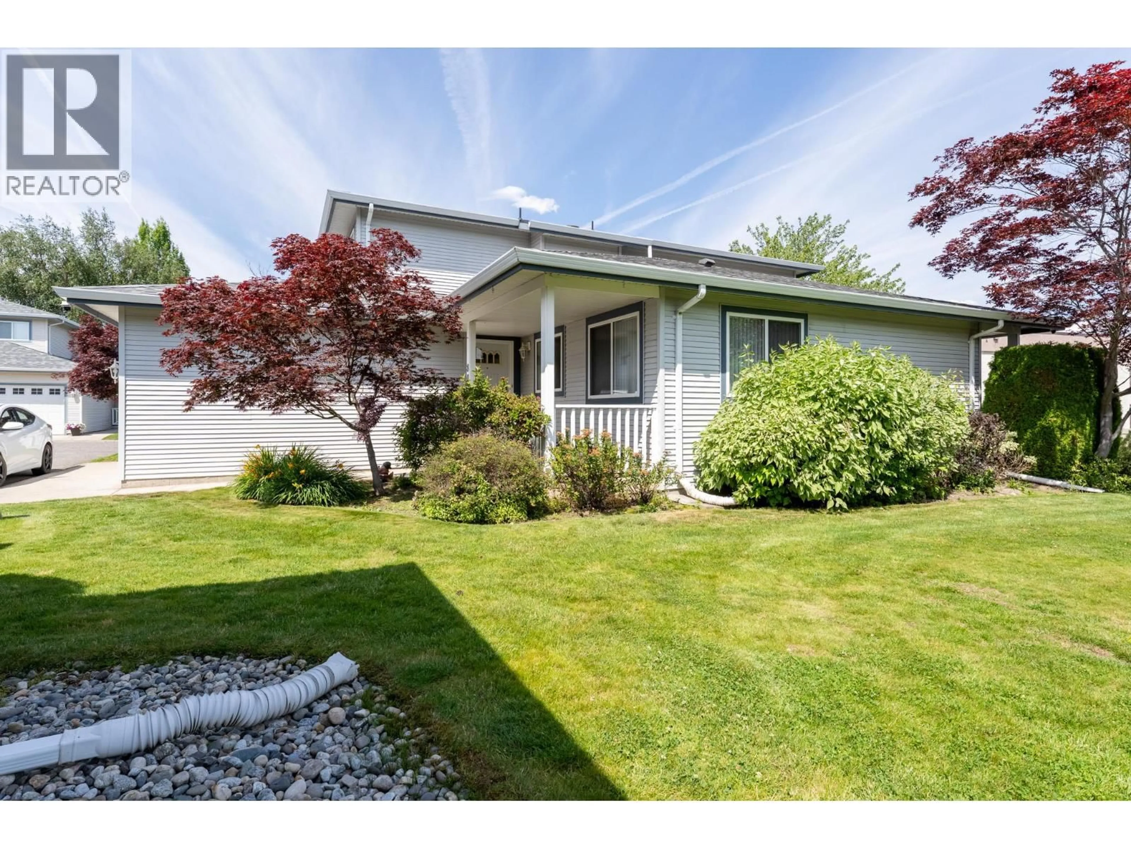 Home with vinyl exterior material, street for 80 - 1120 GUISACHAN ROAD, Kelowna British Columbia V1Y9R5