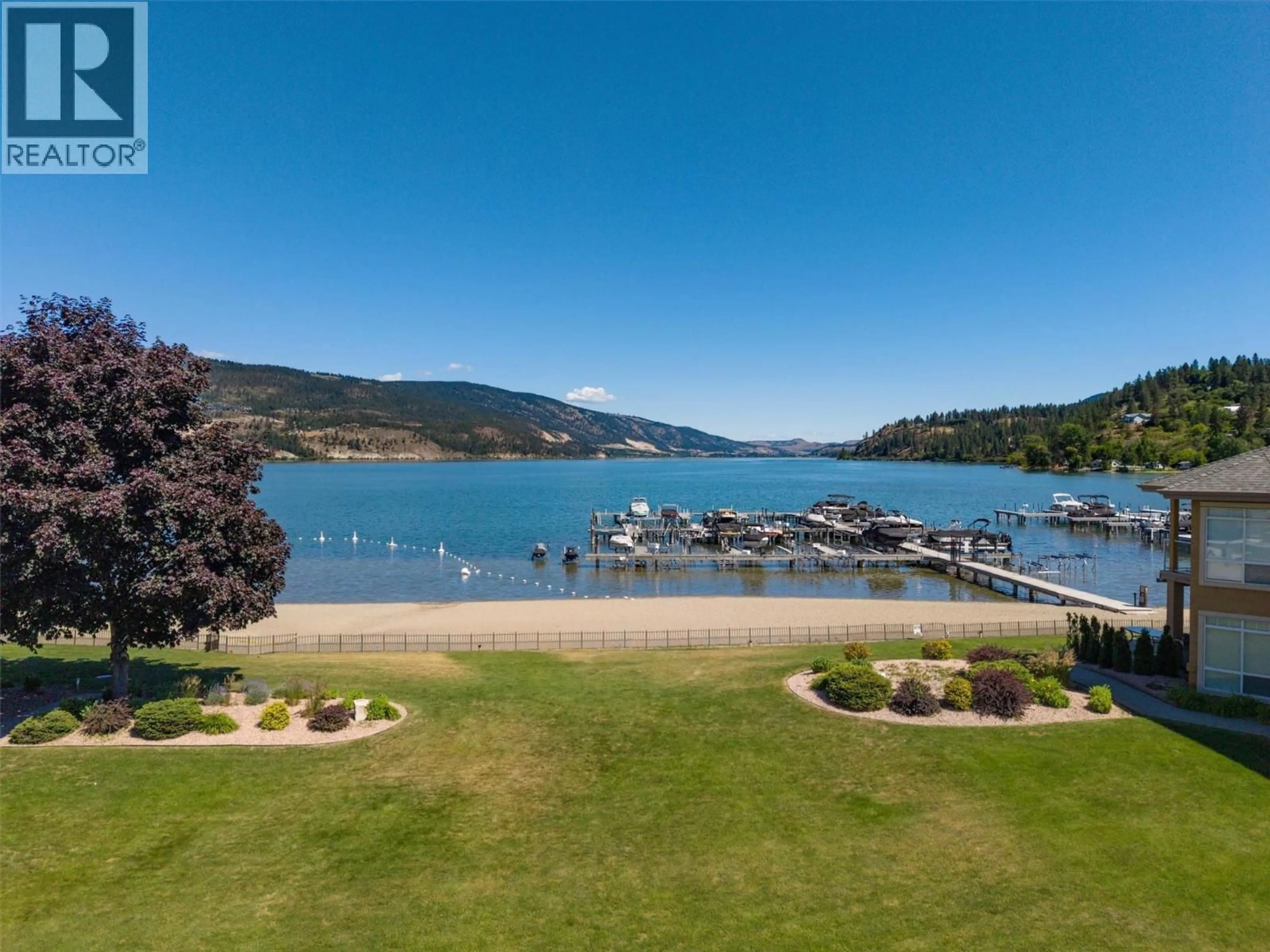 A pic from outside/outdoor area/front of a property/back of a property/a pic from drone, water/lake/river/ocean view for 204 - 3570 WOODSDALE ROAD, Lake Country British Columbia V4V1Y9