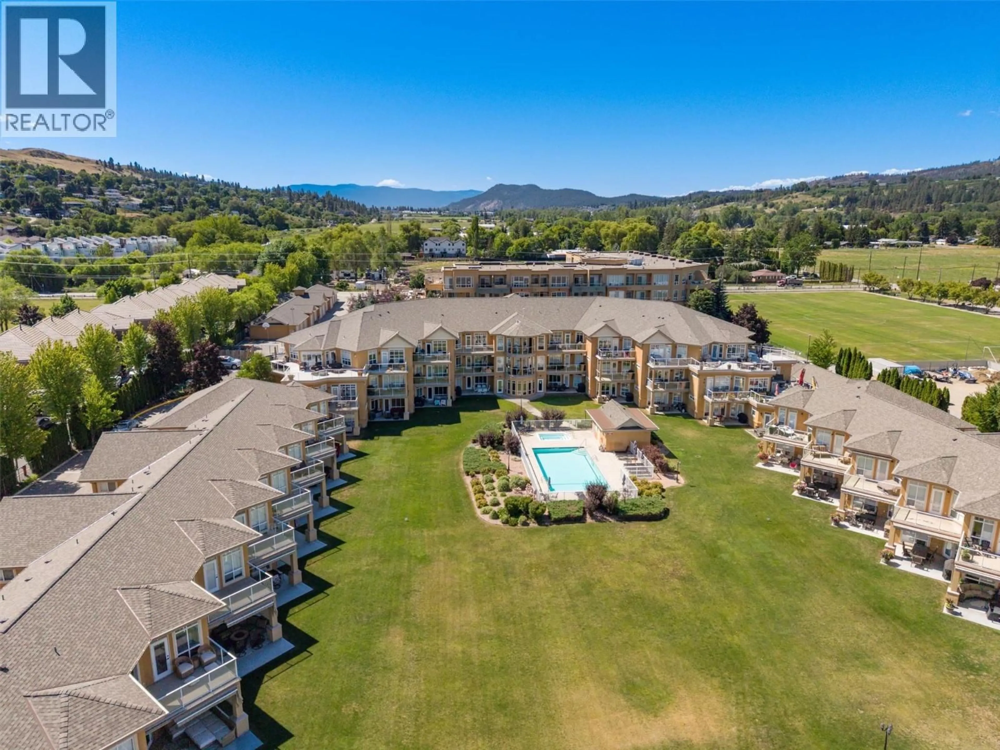 A pic from outside/outdoor area/front of a property/back of a property/a pic from drone, mountain view for 204 - 3570 WOODSDALE ROAD, Lake Country British Columbia V4V1Y9
