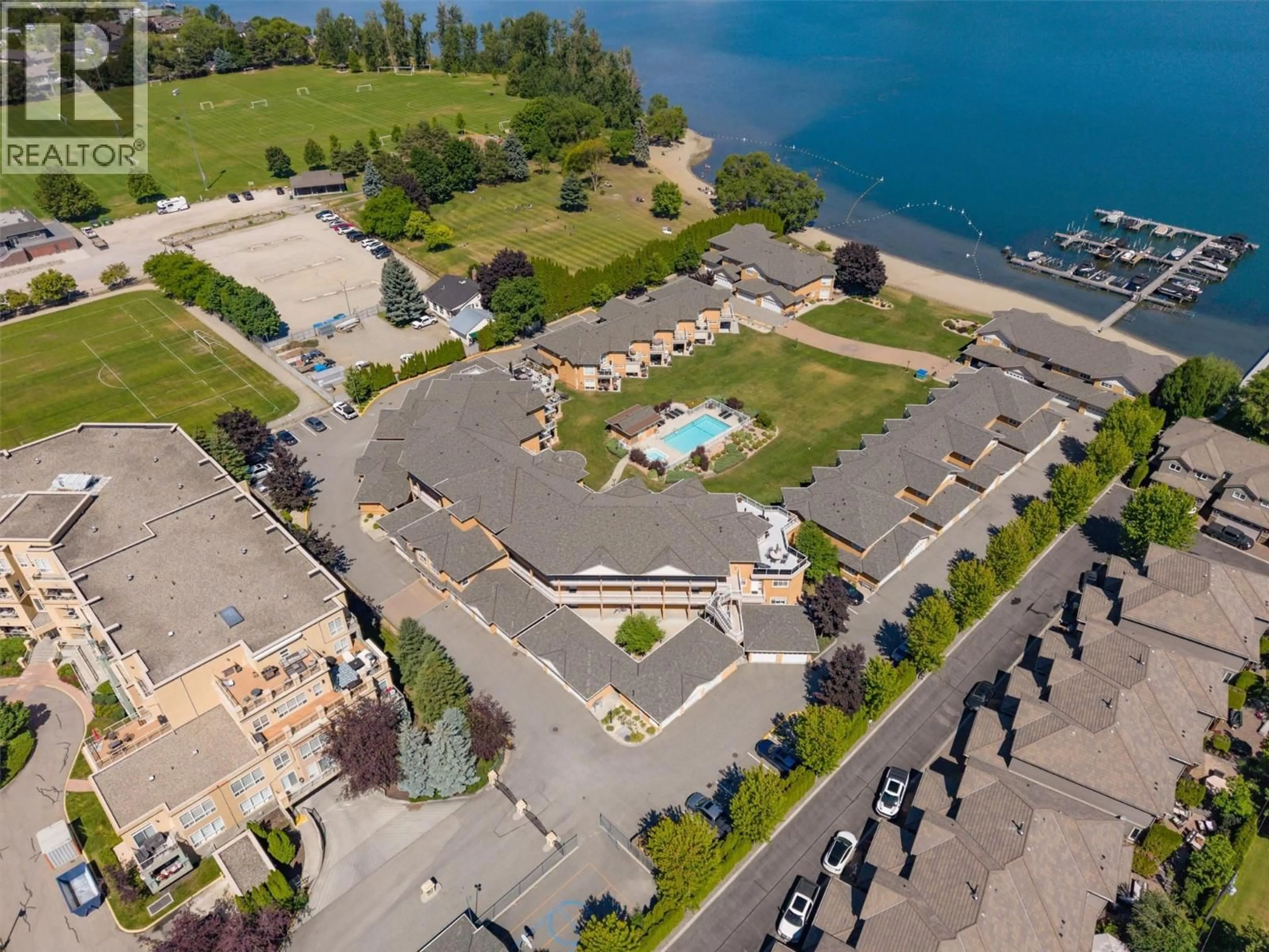 A pic from outside/outdoor area/front of a property/back of a property/a pic from drone, water/lake/river/ocean view for 204 - 3570 WOODSDALE ROAD, Lake Country British Columbia V4V1Y9