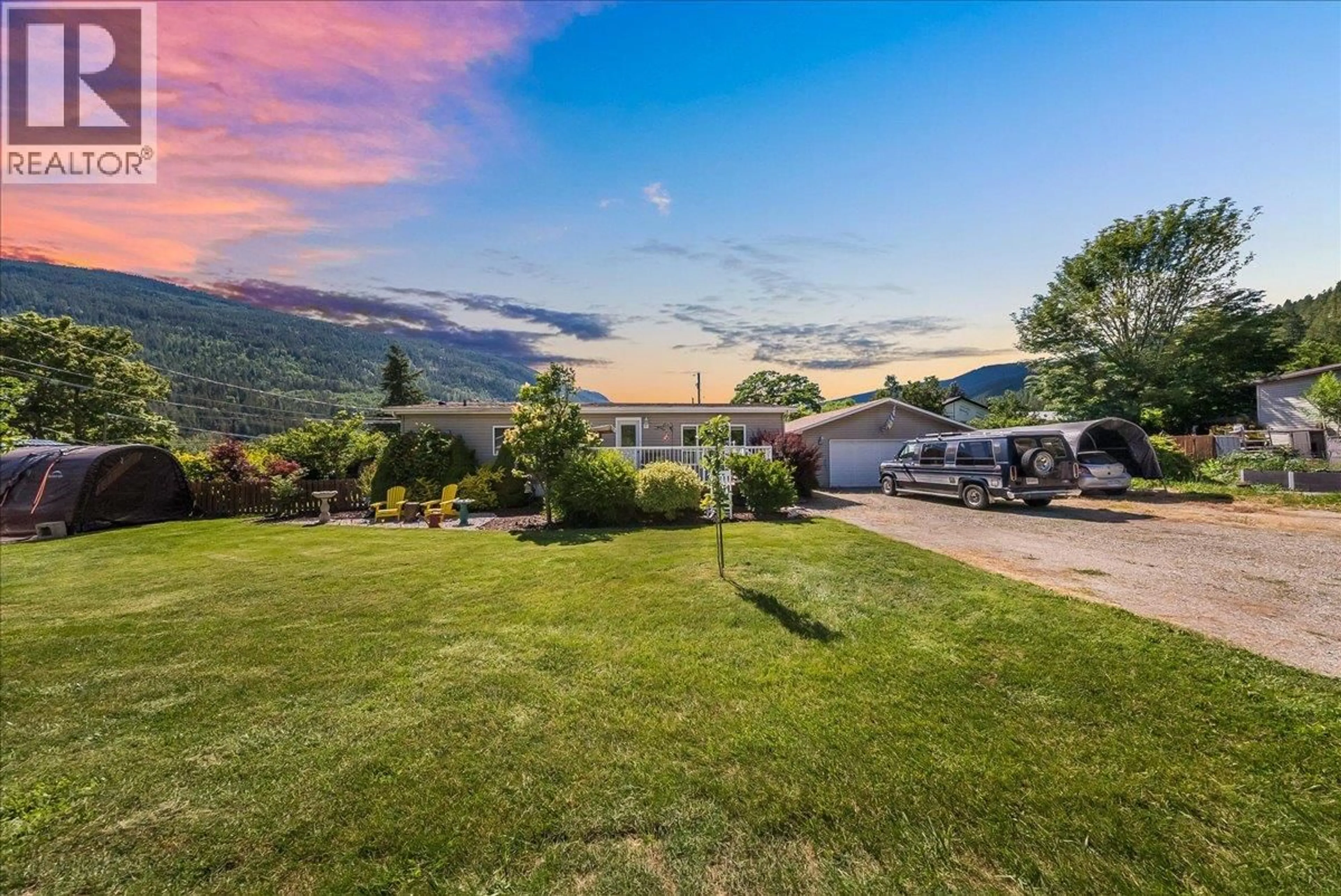 A pic from outside/outdoor area/front of a property/back of a property/a pic from drone, mountain view for 1026 HORCOFF ROAD, Robson British Columbia V1N4V1