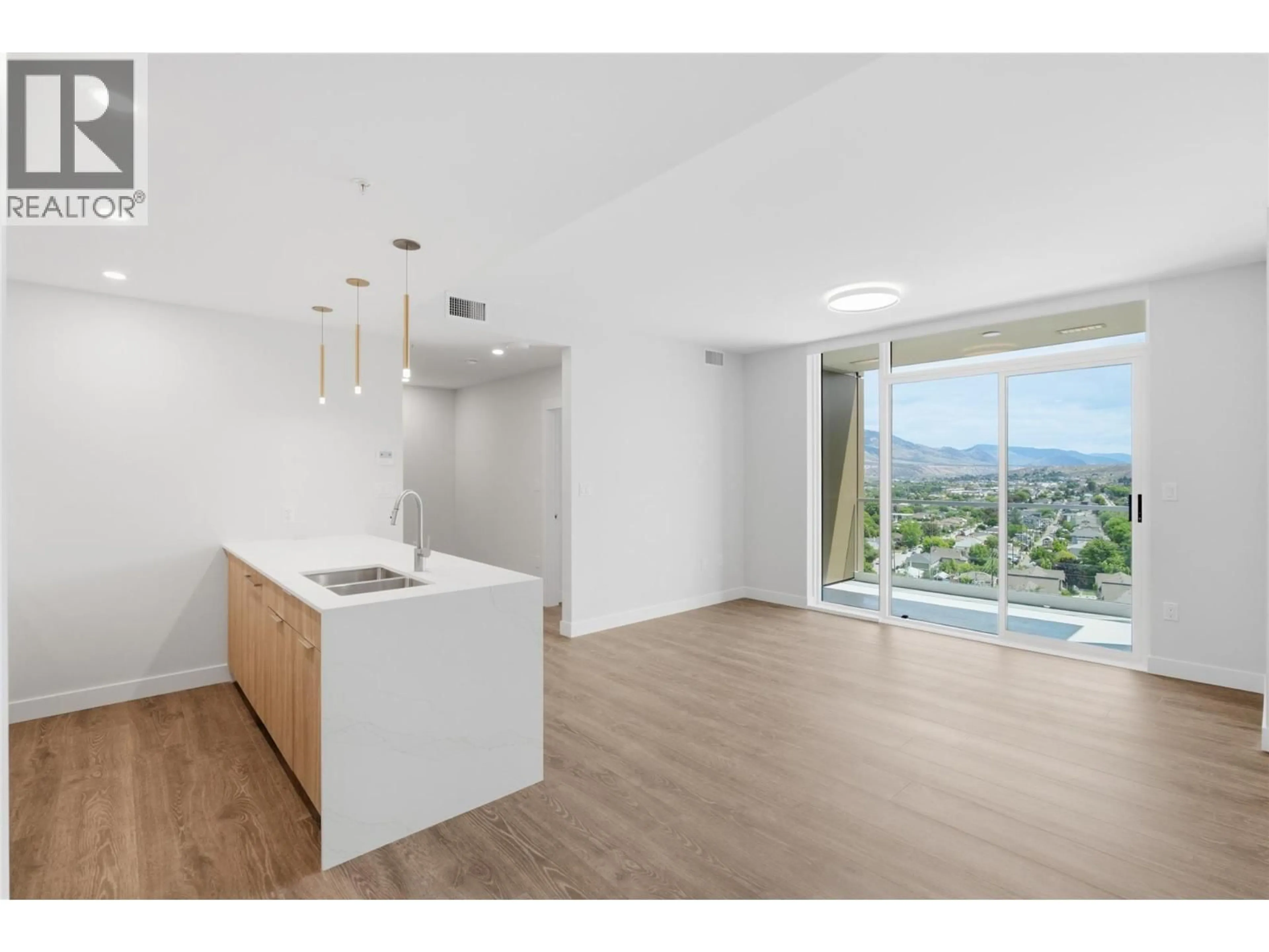 Open concept kitchen, wood/laminate floor for 1303 - 460 NICOLA STREET, Kamloops British Columbia V2C0N2