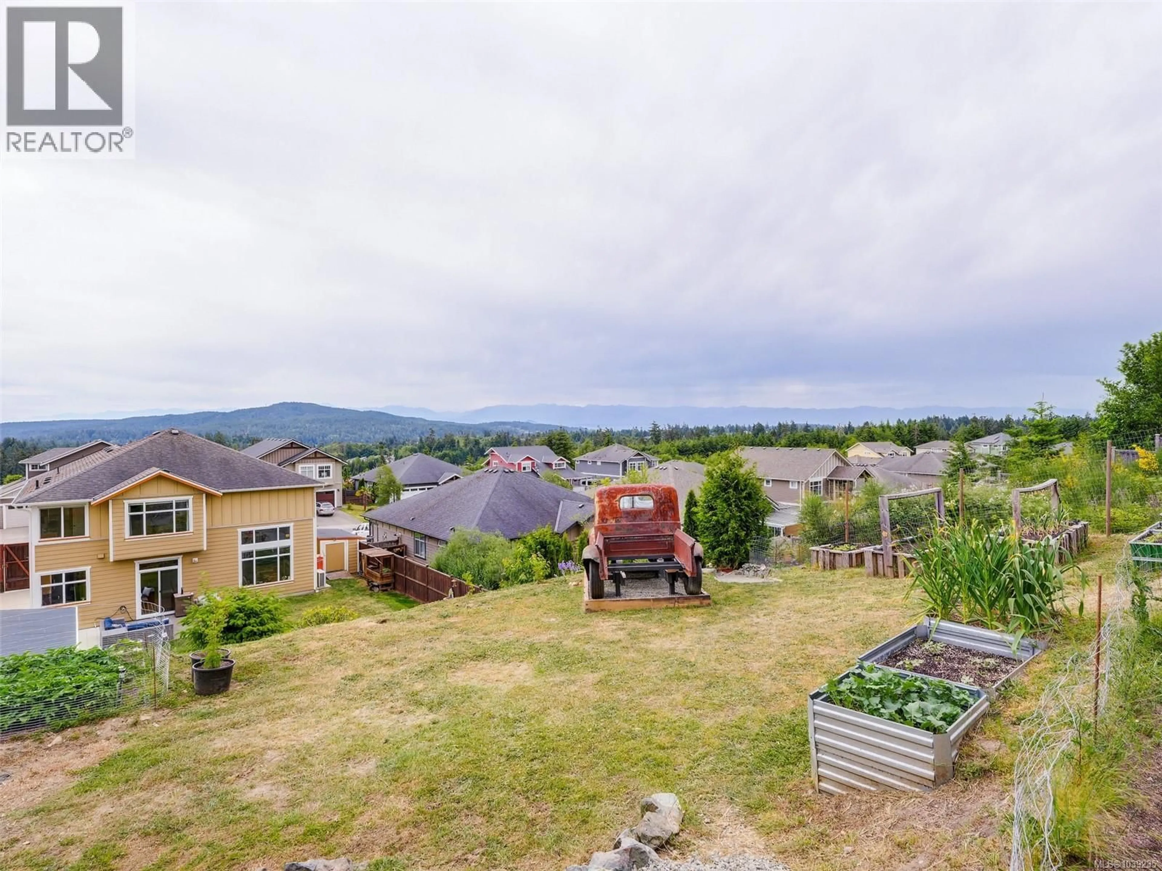 A pic from outside/outdoor area/front of a property/back of a property/a pic from drone, mountain view for 6394 RIVERSTONE DRIVE, Sooke British Columbia V9Z1N4