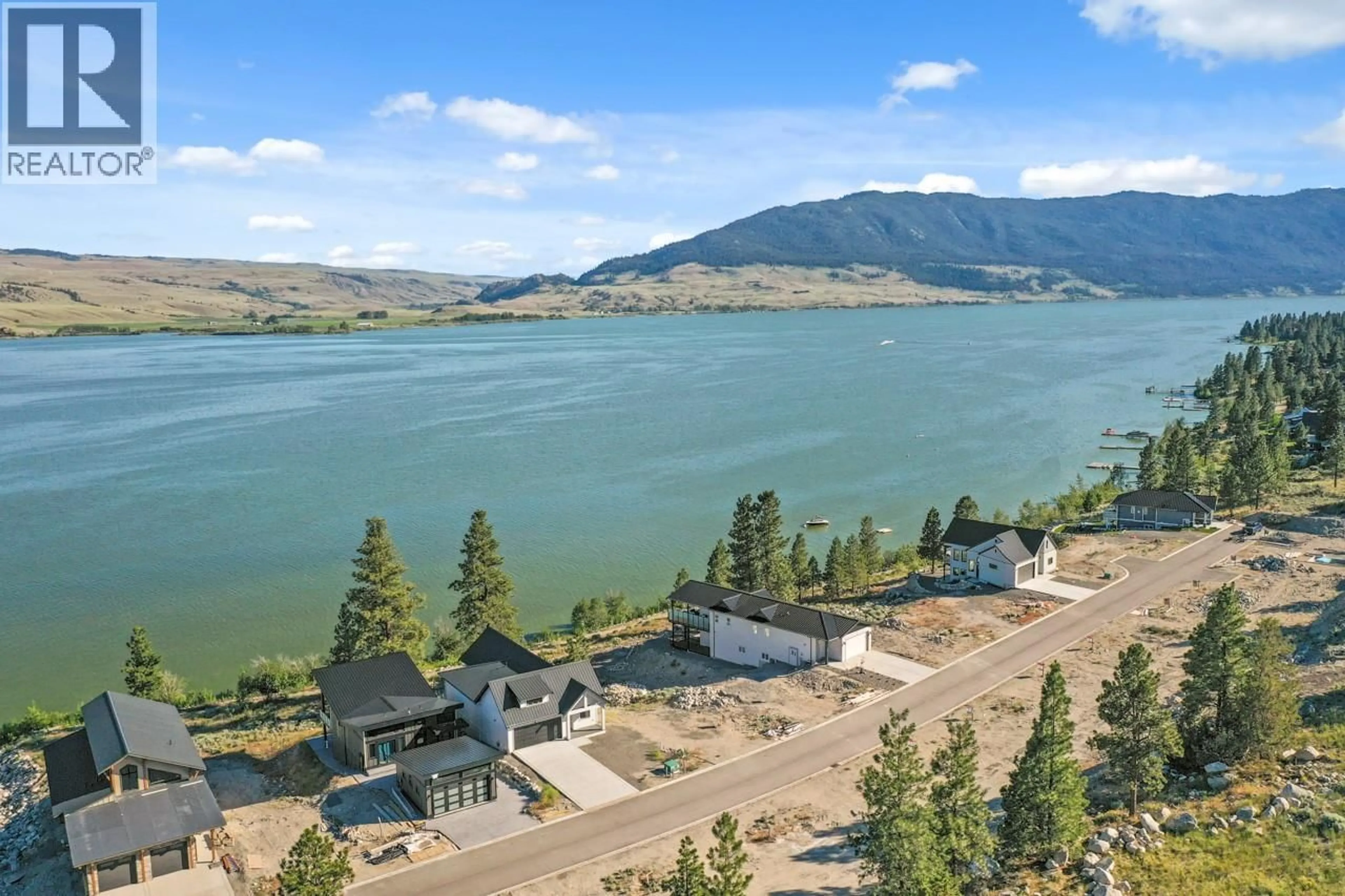 A pic from outside/outdoor area/front of a property/back of a property/a pic from drone, water/lake/river/ocean view for 21 - 6528 WATERSIDE TRAIL, Merritt British Columbia V1K0A1