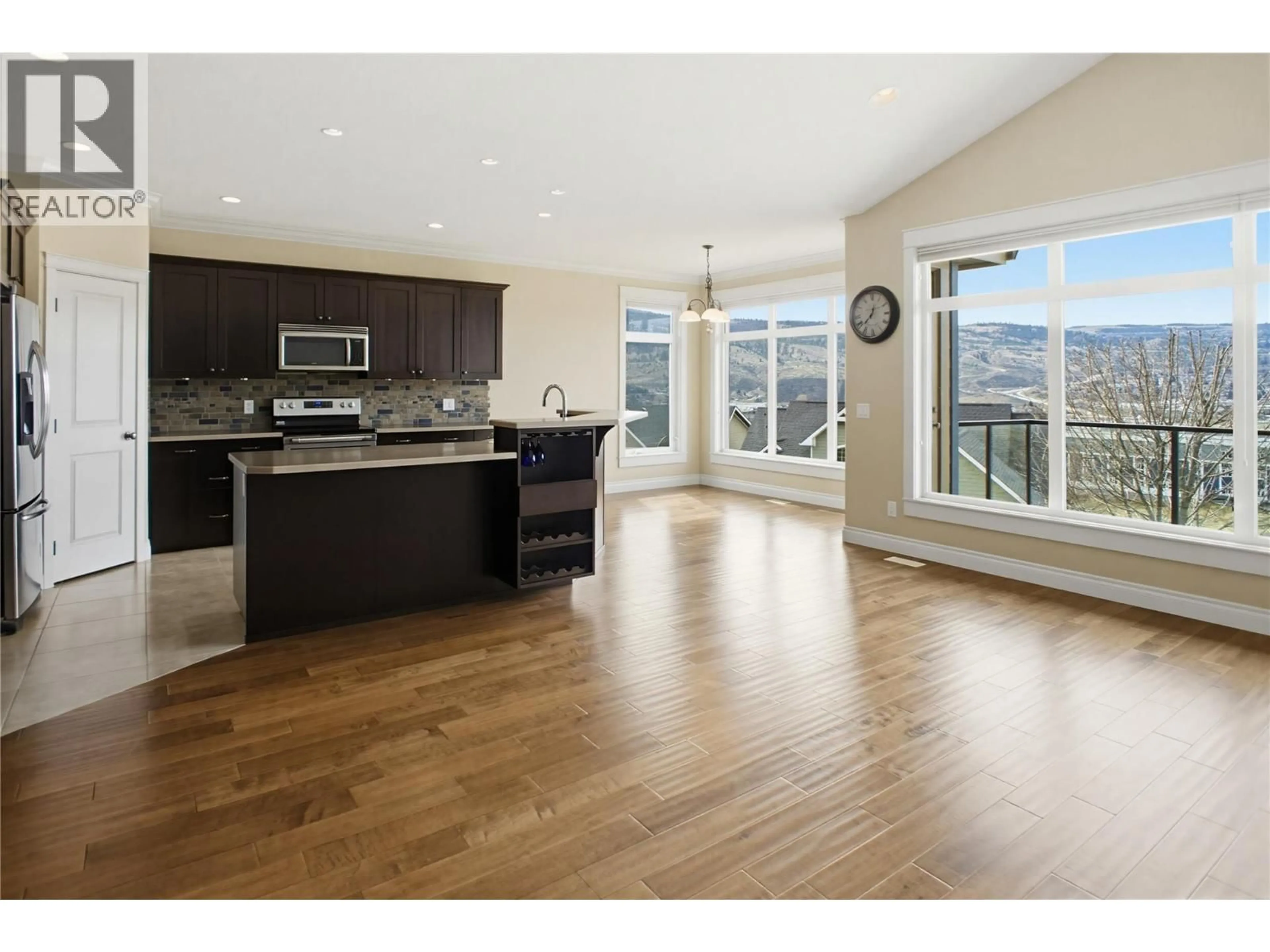 Open concept kitchen, wood/laminate floor for 1708 IRONWOOD DRIVE, Kamloops British Columbia V2H0A6