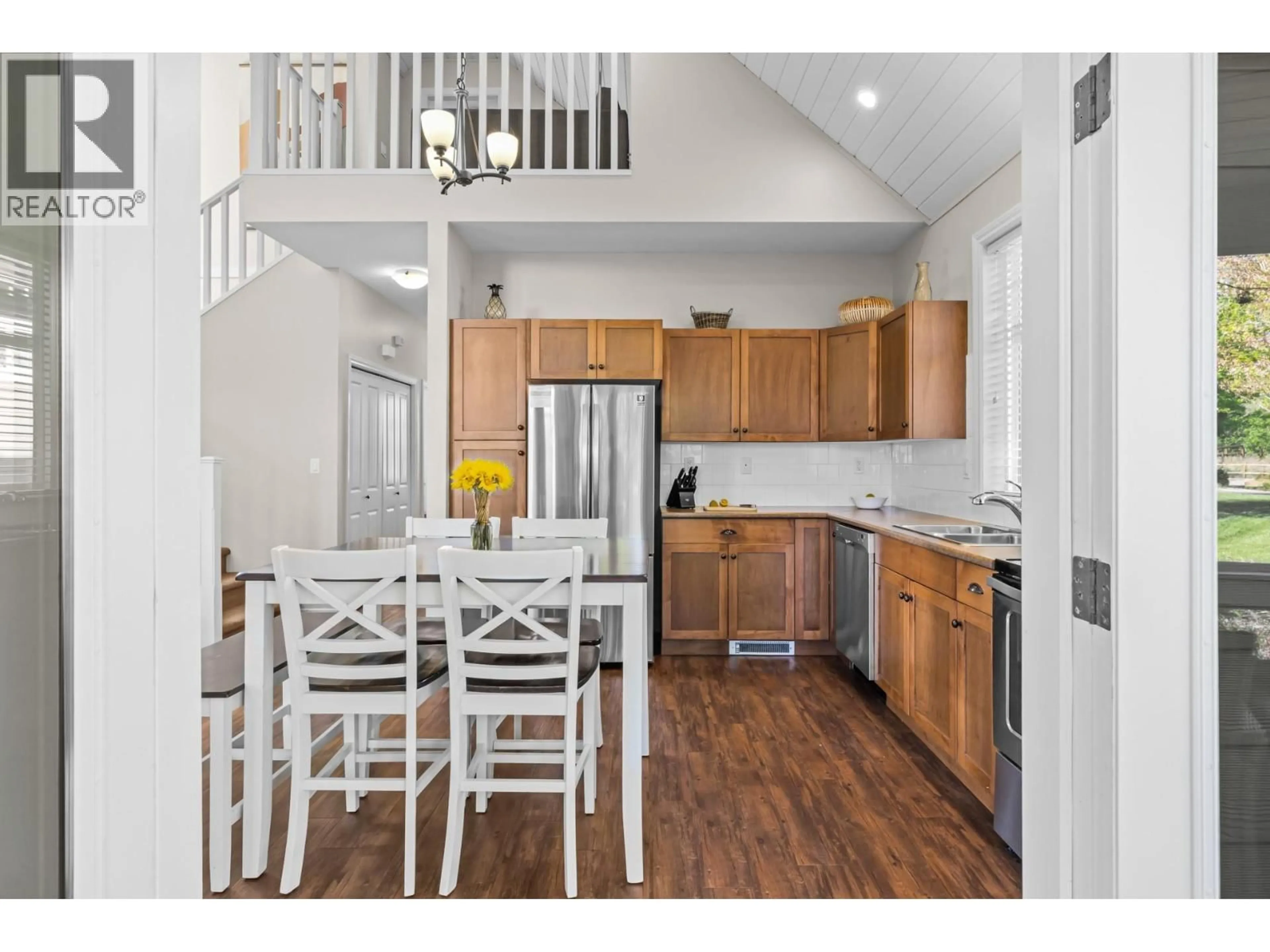 Open concept kitchen, wood/laminate floor for 117 - 2450 RADIO TOWER ROAD, Oliver British Columbia V0H1T1