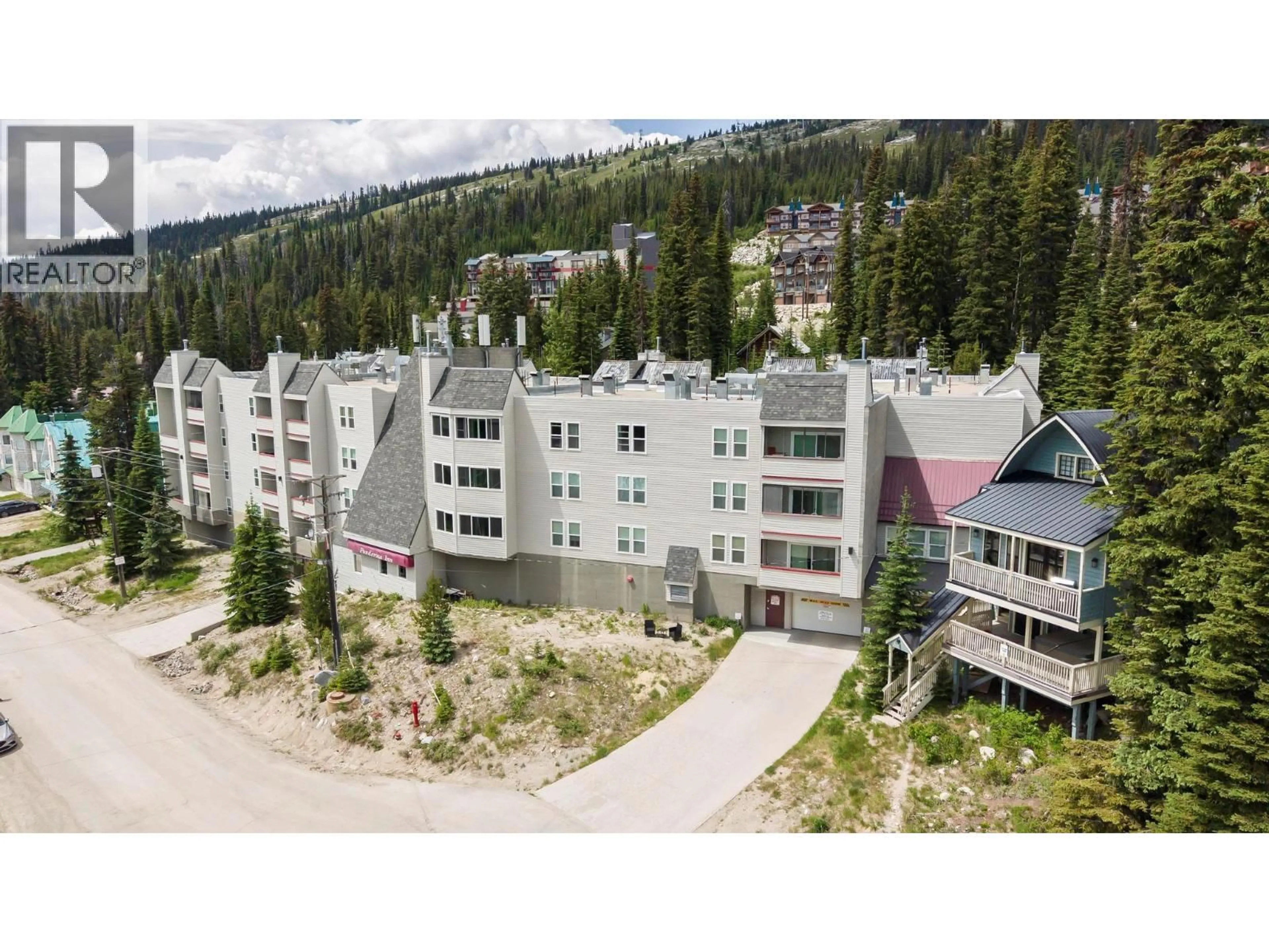 A pic from outside/outdoor area/front of a property/back of a property/a pic from drone, mountain view for 210 - 60 WOLVERINE ROAD, Big White British Columbia V1P1P3