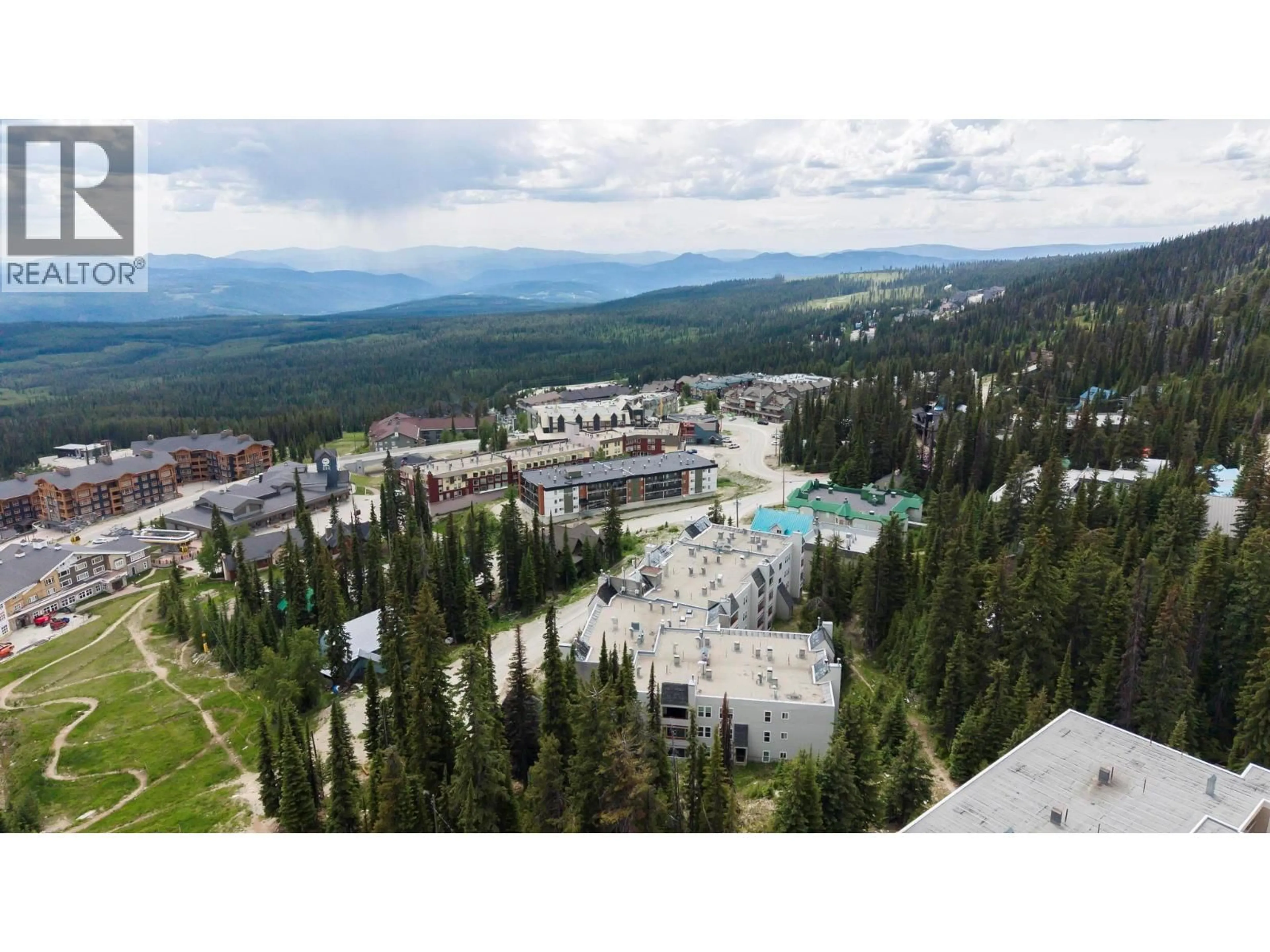 A pic from outside/outdoor area/front of a property/back of a property/a pic from drone, mountain view for 210 - 60 WOLVERINE ROAD, Big White British Columbia V1P1P3