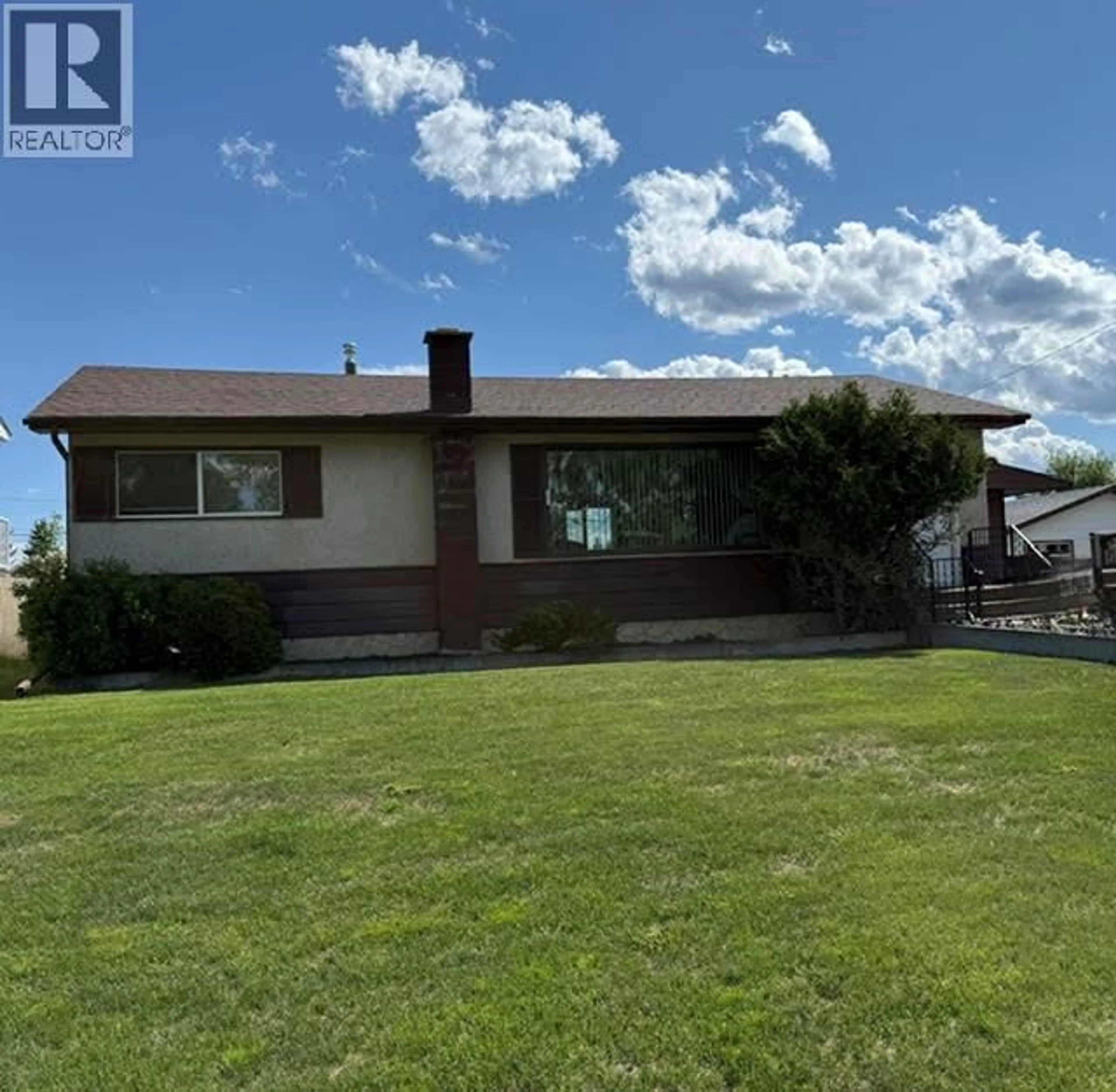 A pic from outside/outdoor area/front of a property/back of a property/a pic from drone, unknown for 1025 92 AVENUE, Dawson Creek British Columbia V1G1C2