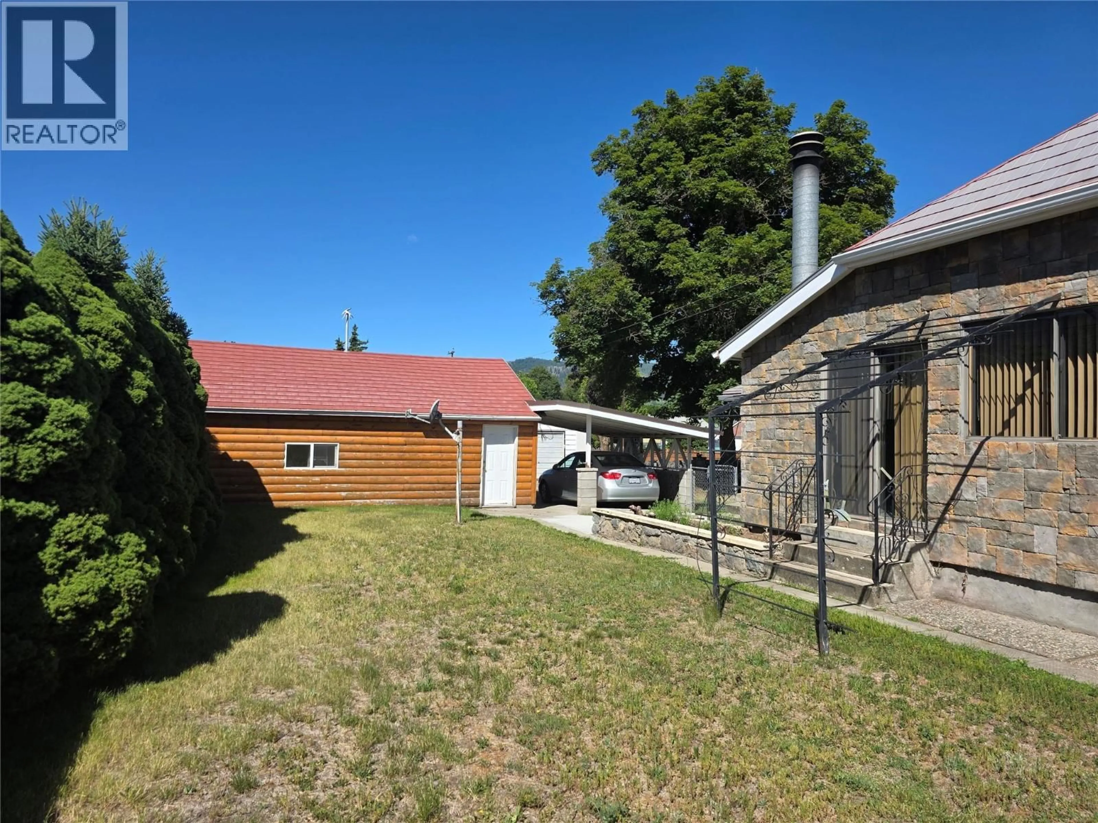A pic from outside/outdoor area/front of a property/back of a property/a pic from drone, street for 7277 8TH STREET, Grand Forks British Columbia V0H1H0
