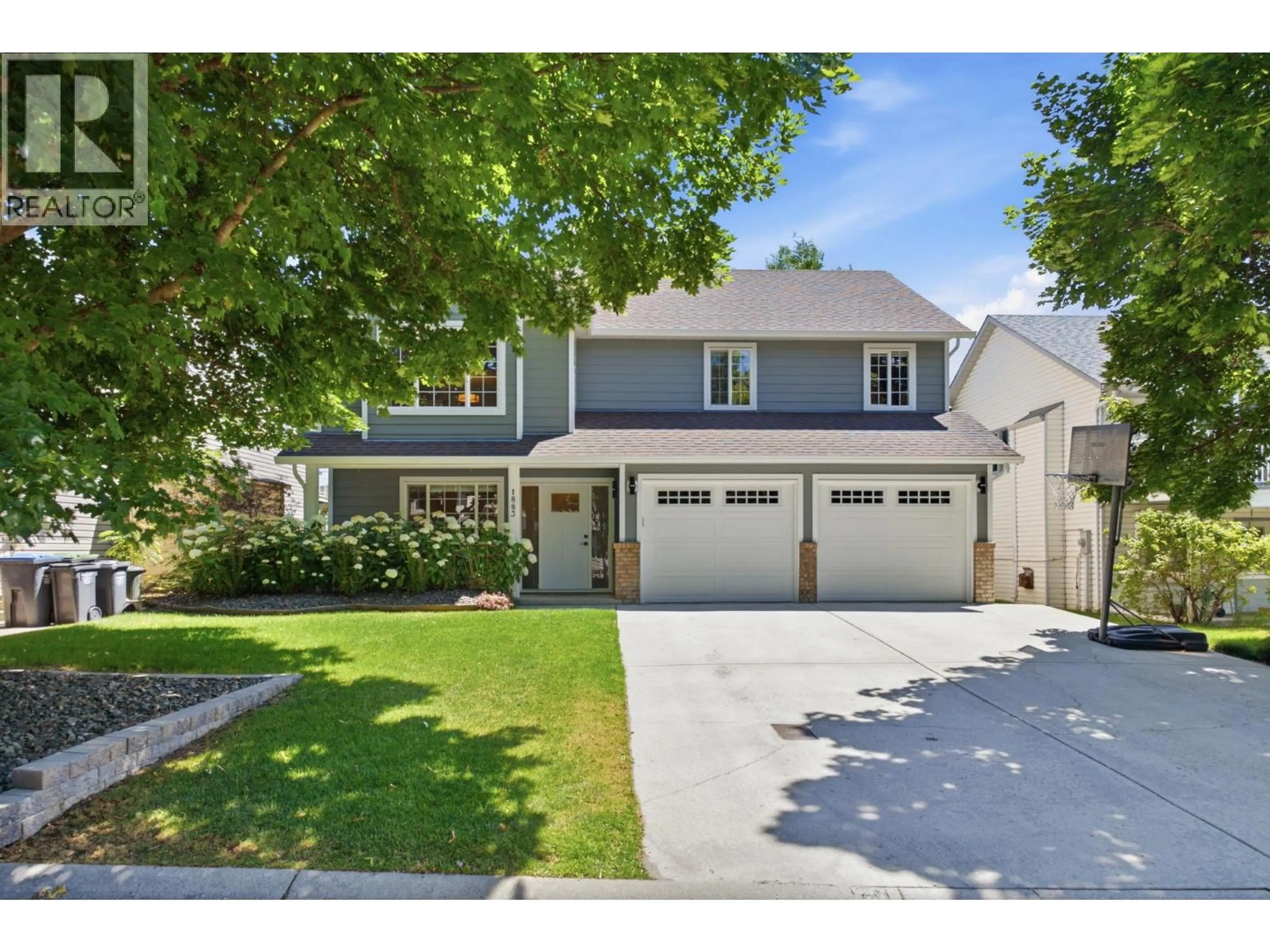 Home with vinyl exterior material, street for 1883 MILLARD COURT EAST, Kelowna British Columbia V1V1R2