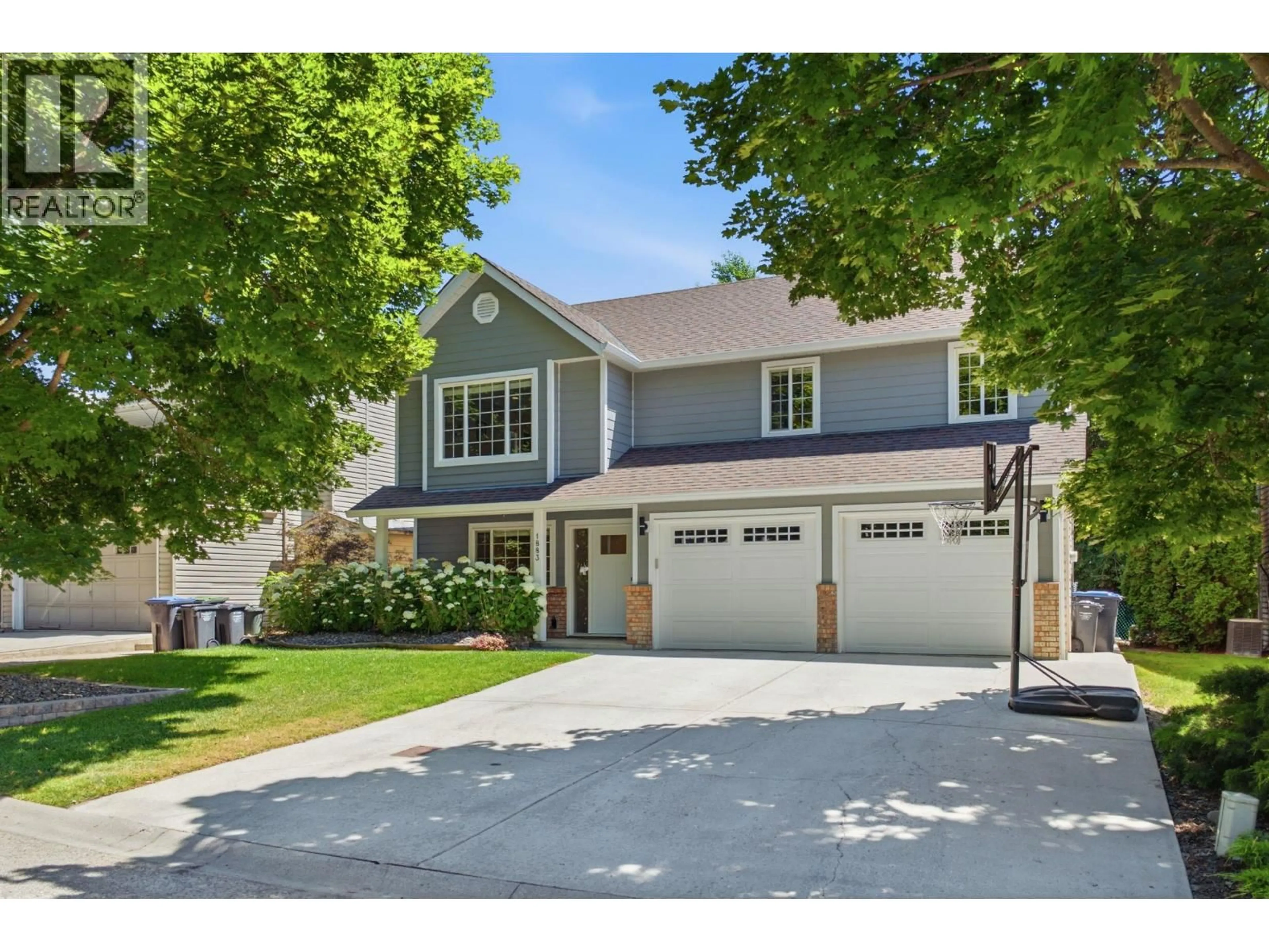 Home with vinyl exterior material, street for 1883 MILLARD COURT EAST, Kelowna British Columbia V1V1R2