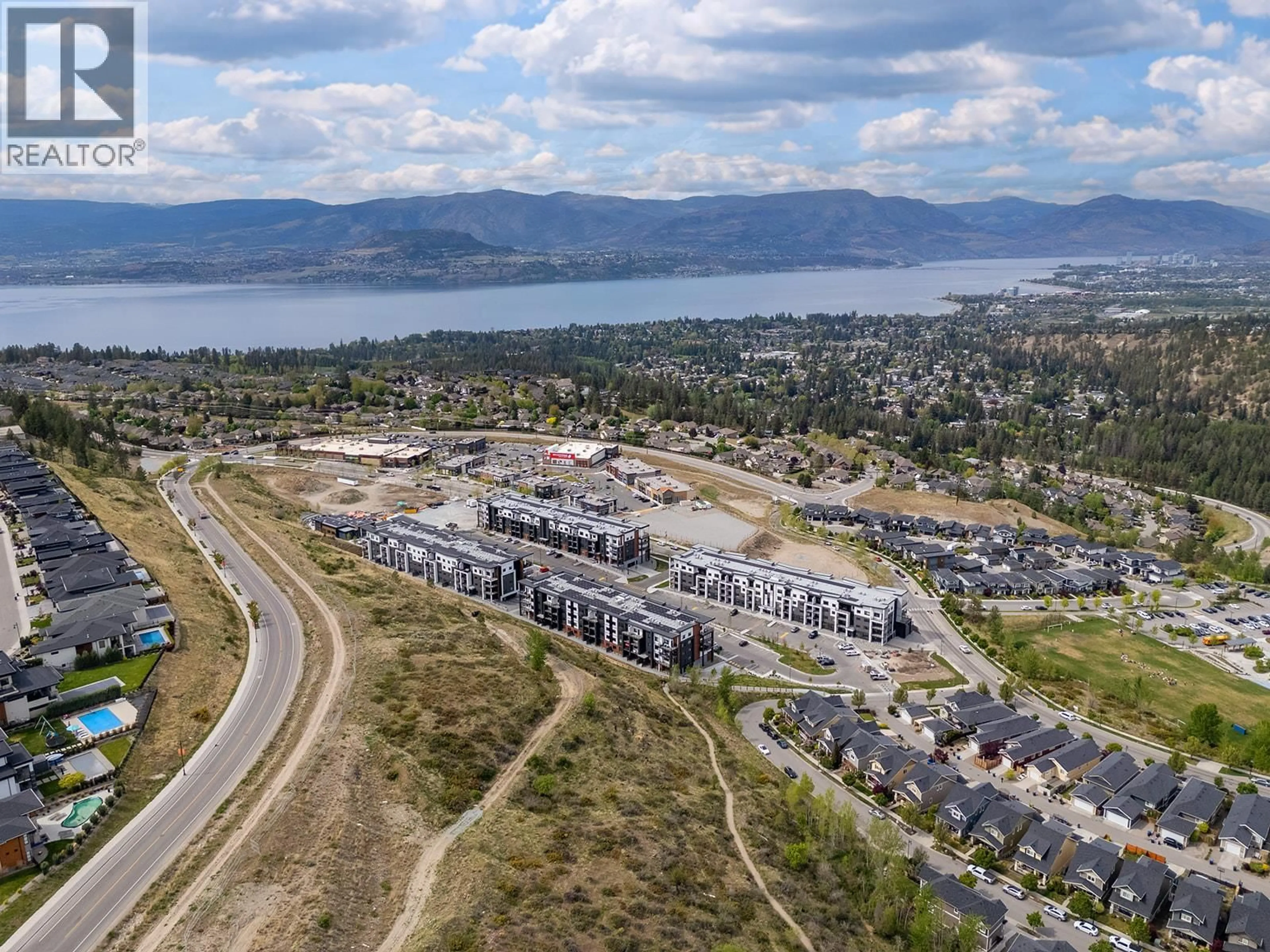A pic from outside/outdoor area/front of a property/back of a property/a pic from drone, mountain view for 318 - 1057 FROST ROAD, Kelowna British Columbia V1W0G7
