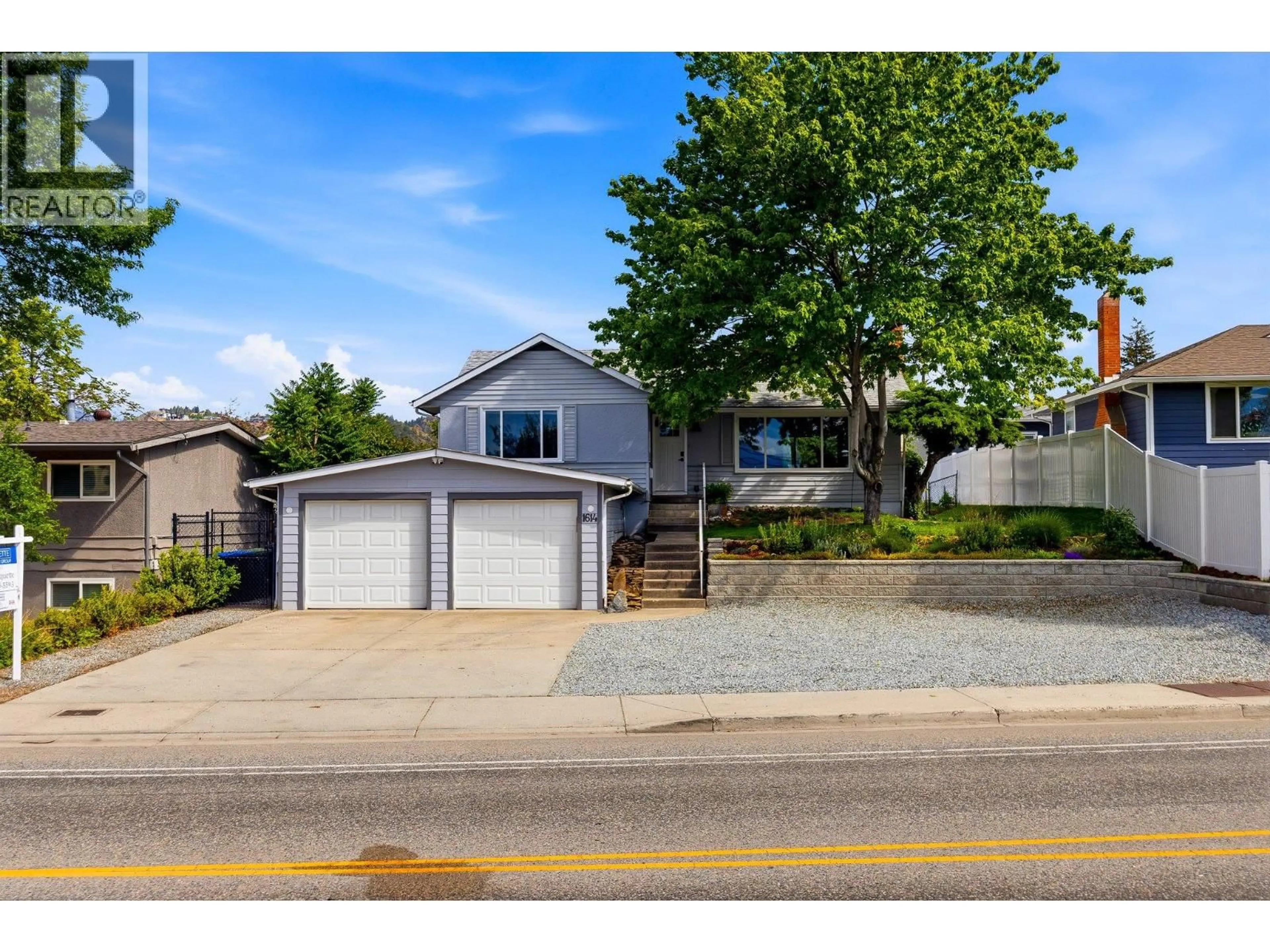 Home with vinyl exterior material, street for 1614 BERNARD AVENUE, Kelowna British Columbia V1Y6R9