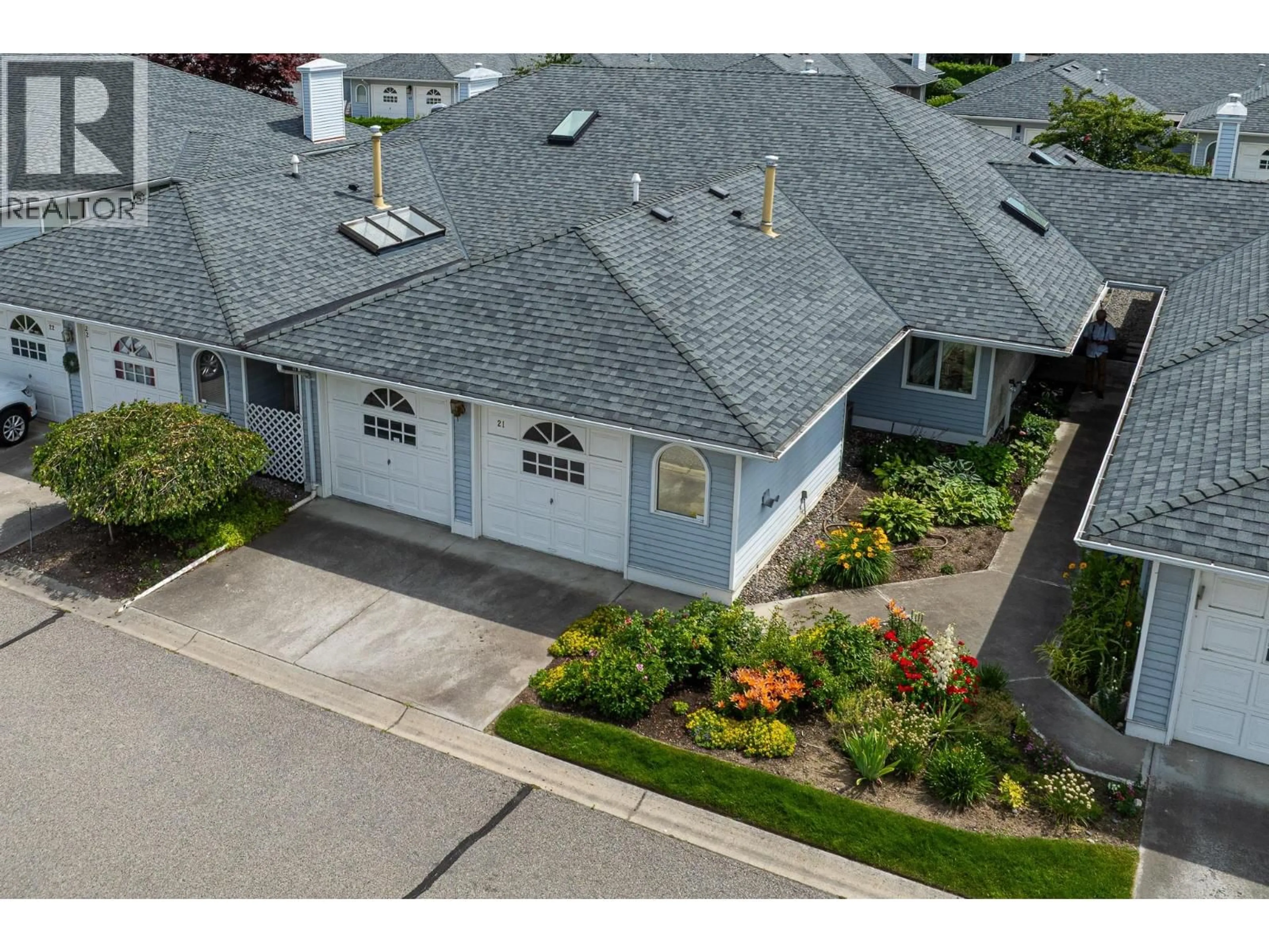 A pic from outside/outdoor area/front of a property/back of a property/a pic from drone, street for 21 - 3370 CASORSO ROAD, Kelowna British Columbia V1Y2V4