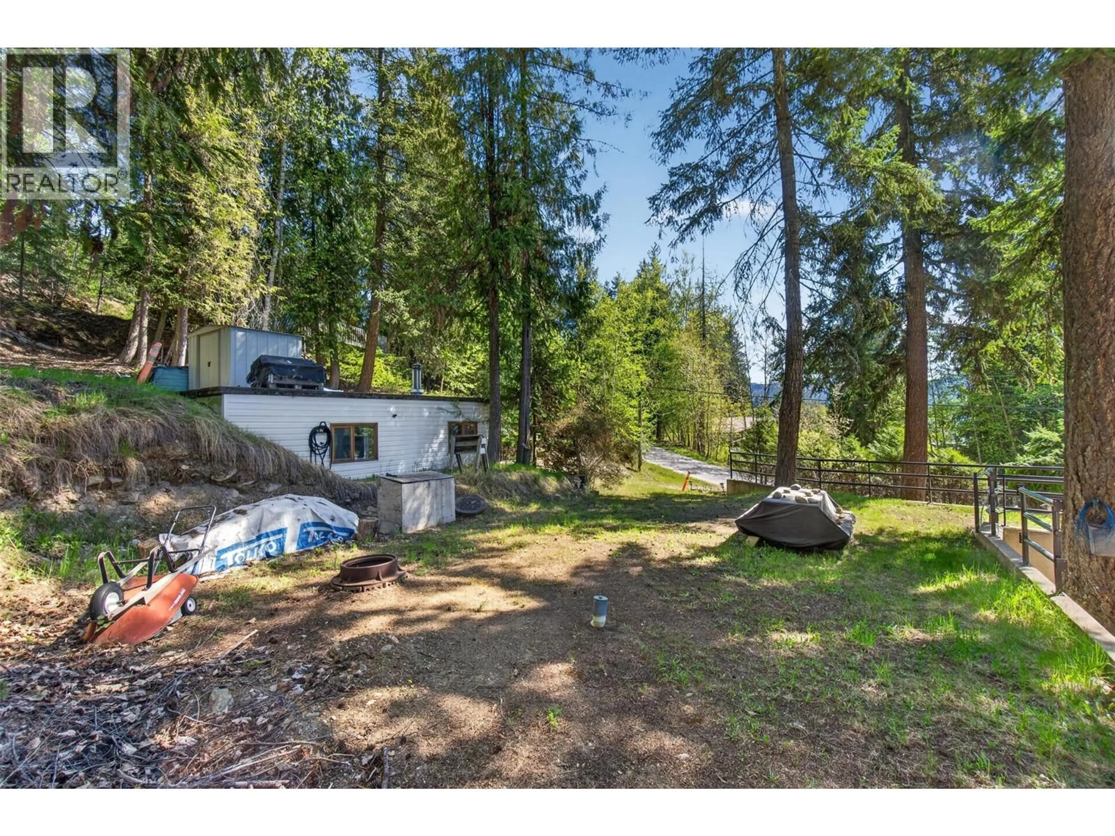 A pic from outside/outdoor area/front of a property/back of a property/a pic from drone, forest/trees view for 7689 GOLF COURSE ROAD, Anglemont British Columbia V0E1M8