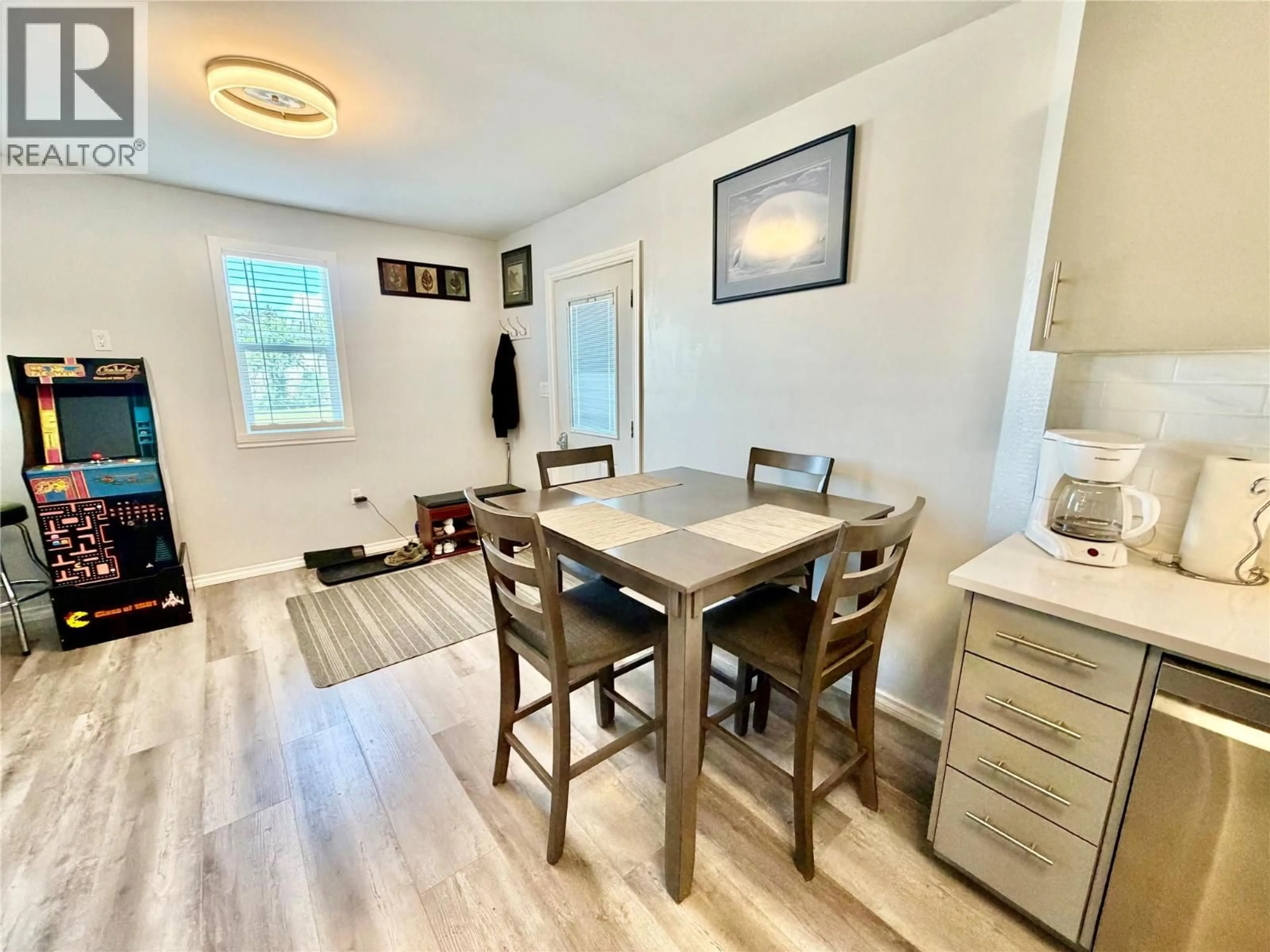 Dining room, wood/laminate floor for 1633 100 AVENUE, Dawson Creek British Columbia V1G1X3