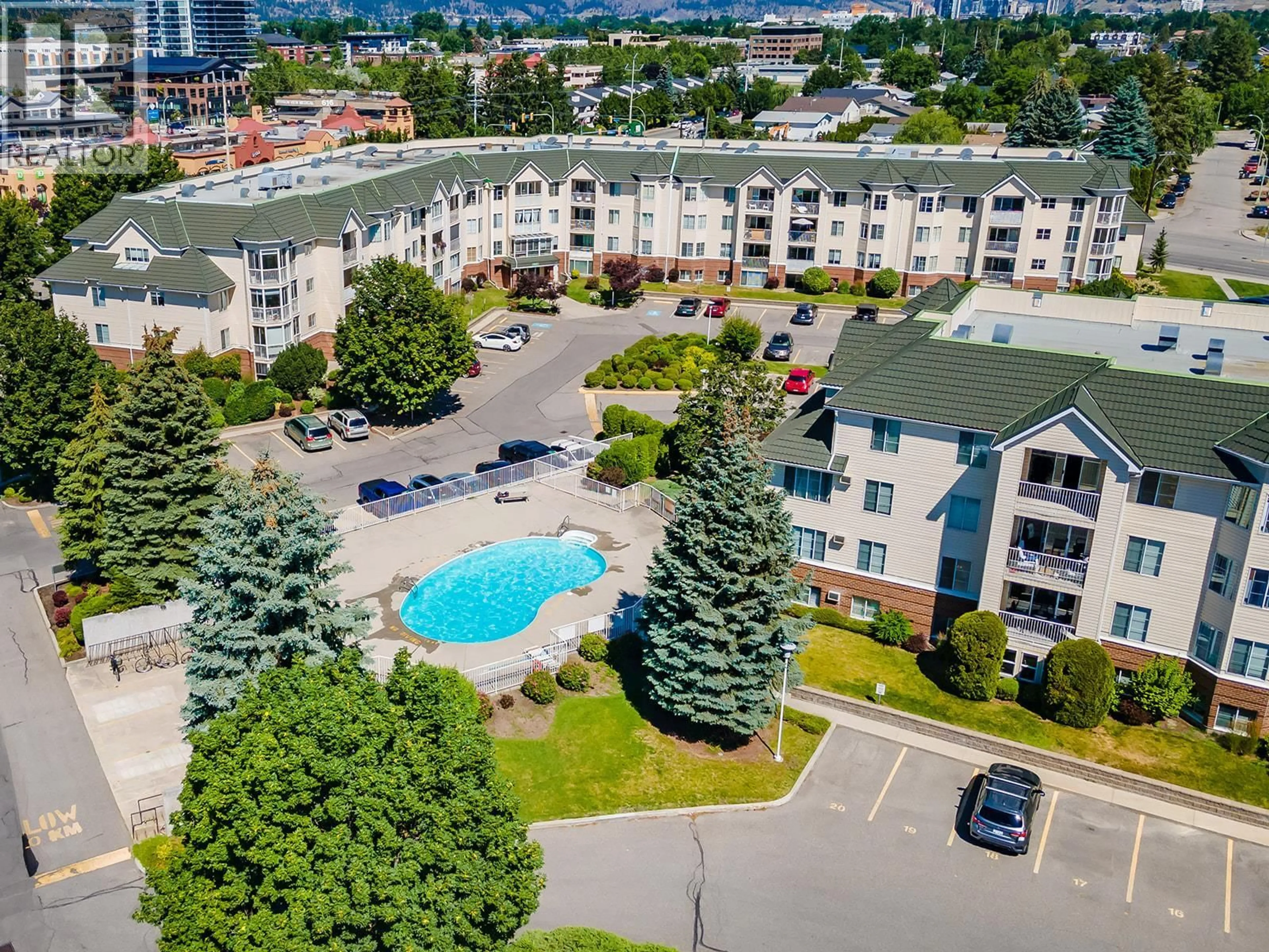 A pic from outside/outdoor area/front of a property/back of a property/a pic from drone, city buildings view from balcony for 316 - 769 KLO ROAD, Kelowna British Columbia V1Y9L9