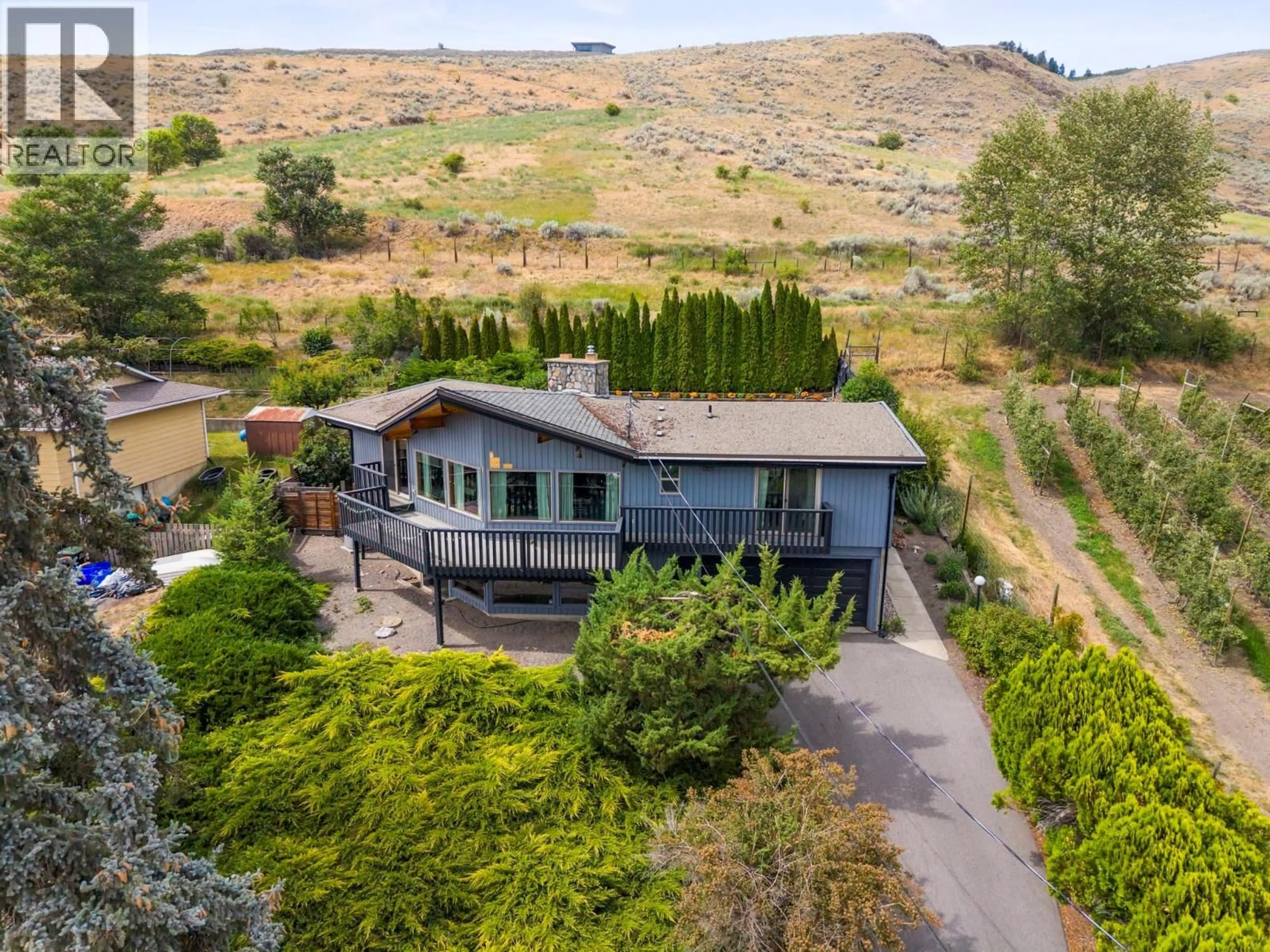 A pic from outside/outdoor area/front of a property/back of a property/a pic from drone, mountain view for 6451 SOUTHWIND ROAD, Vernon British Columbia V1H1B7