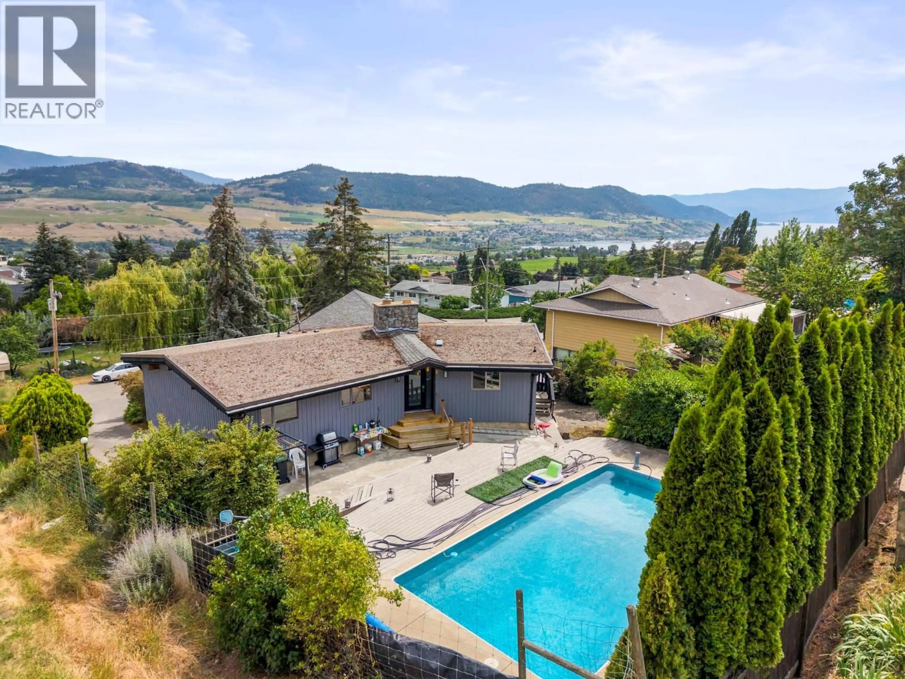 A pic from outside/outdoor area/front of a property/back of a property/a pic from drone, mountain view for 6451 SOUTHWIND ROAD, Vernon British Columbia V1H1B7