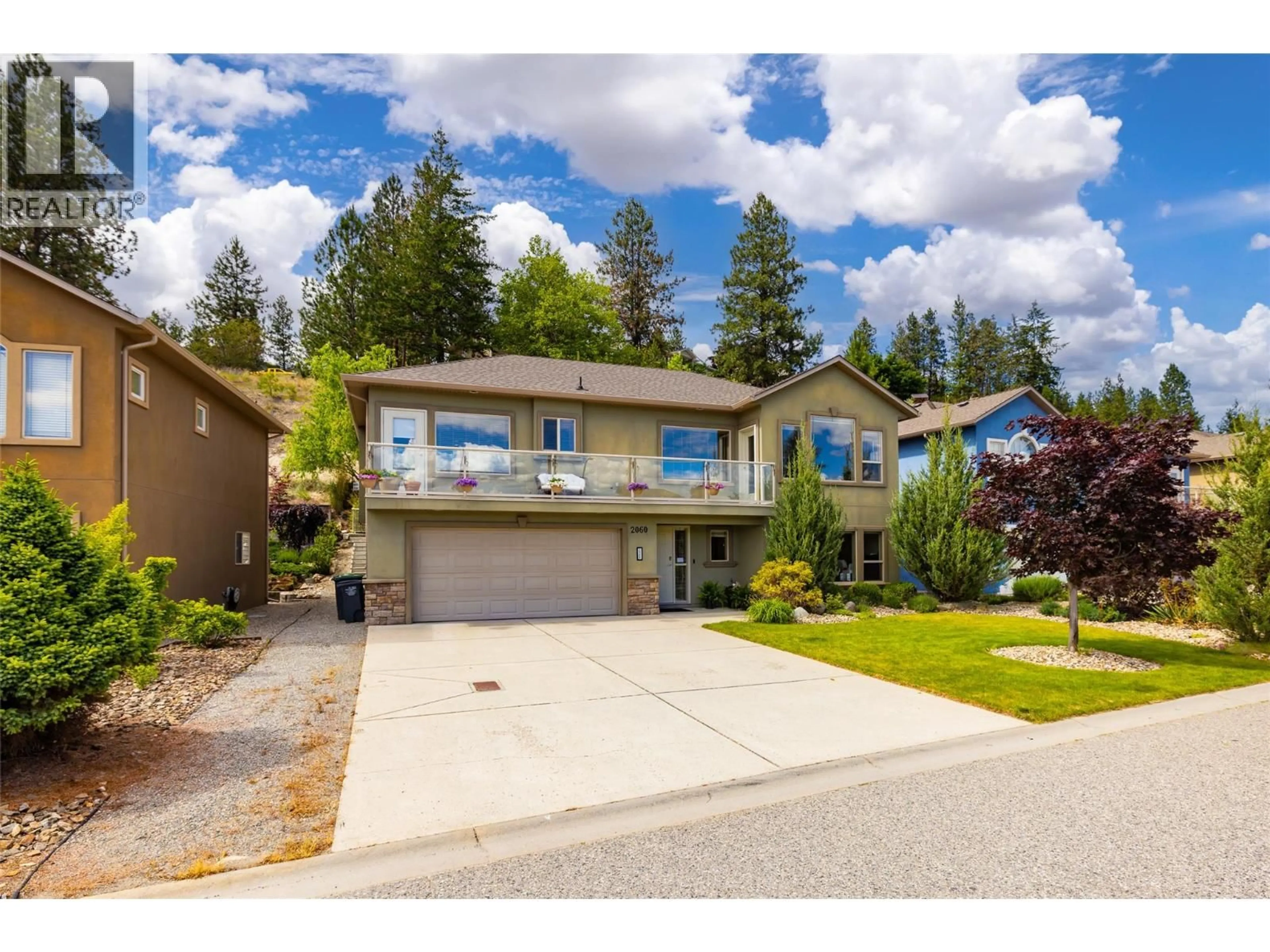 Home with vinyl exterior material, street for 2060 SPYGLASS WAY, West Kelowna British Columbia V1Z3Z7