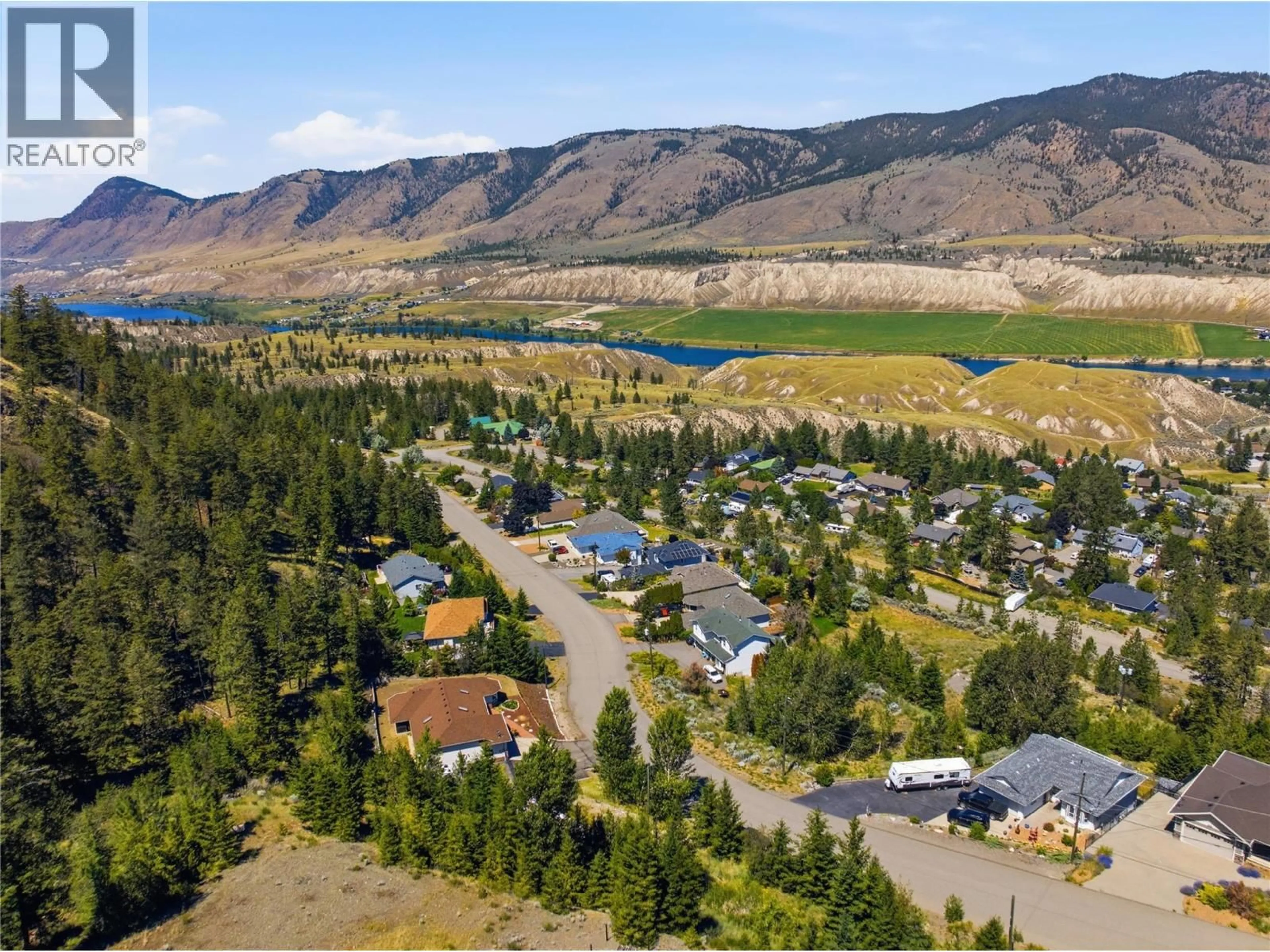 A pic from outside/outdoor area/front of a property/back of a property/a pic from drone, mountain view for 4826 UPLANDS DRIVE, Kamloops British Columbia V2C6S9