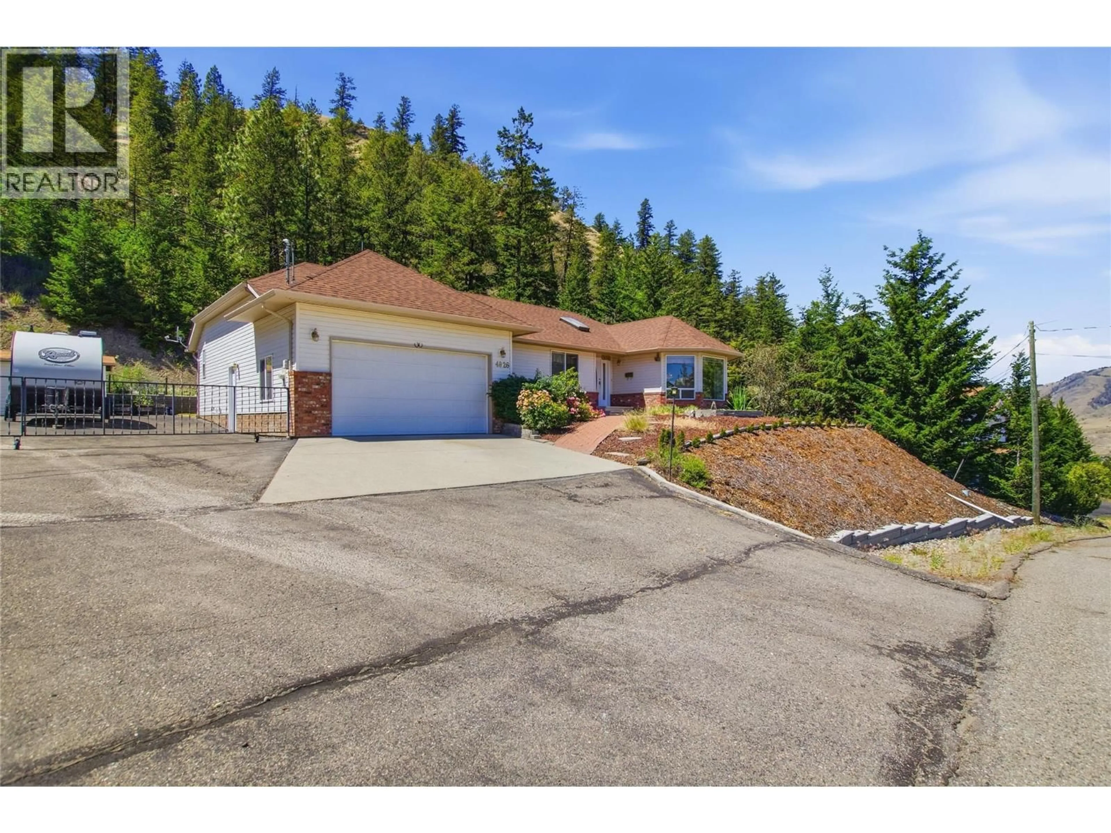A pic from outside/outdoor area/front of a property/back of a property/a pic from drone, street for 4826 UPLANDS DRIVE, Kamloops British Columbia V2C6S9