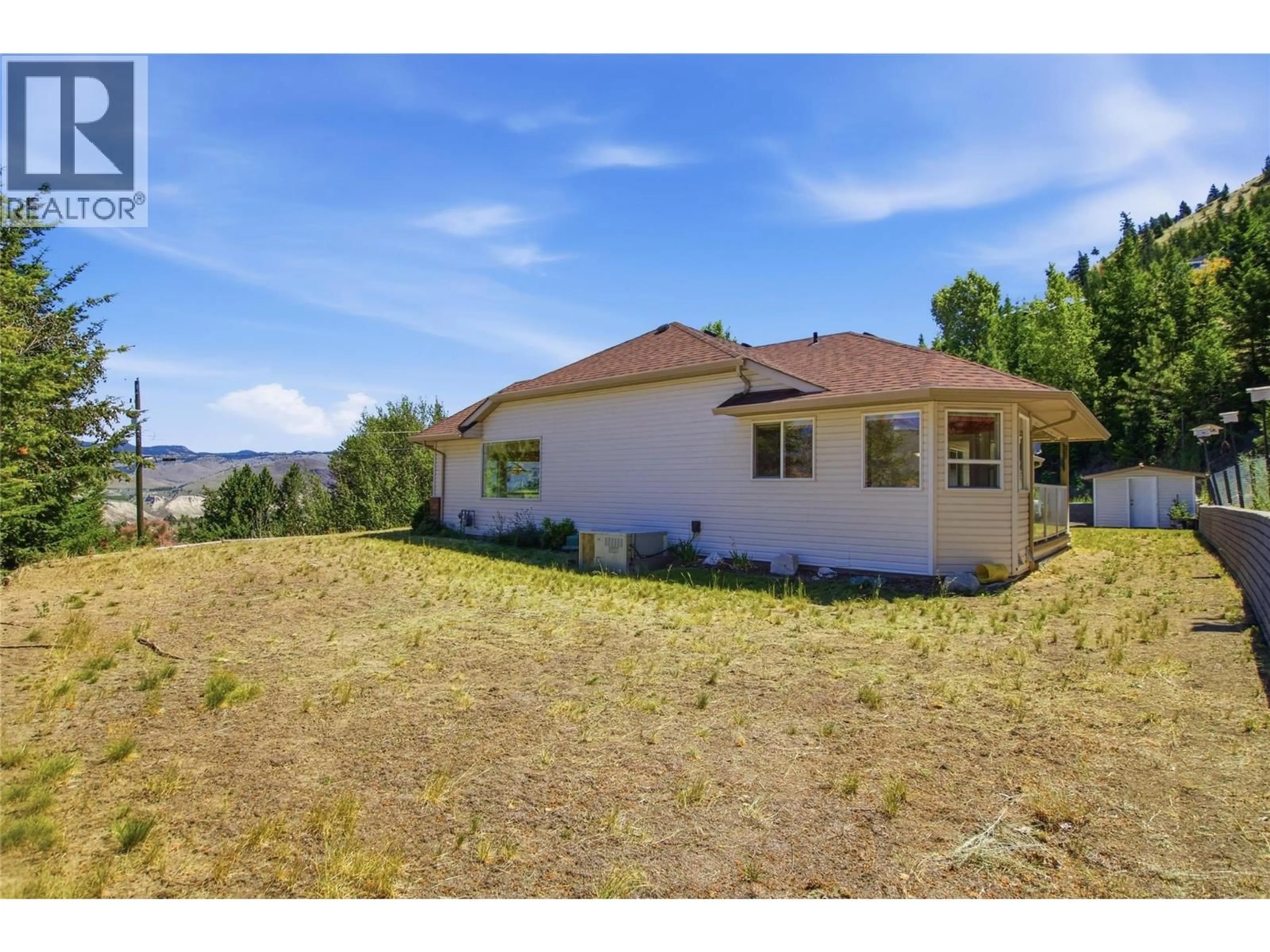A pic from outside/outdoor area/front of a property/back of a property/a pic from drone, mountain view for 4826 UPLANDS DRIVE, Kamloops British Columbia V2C6S9