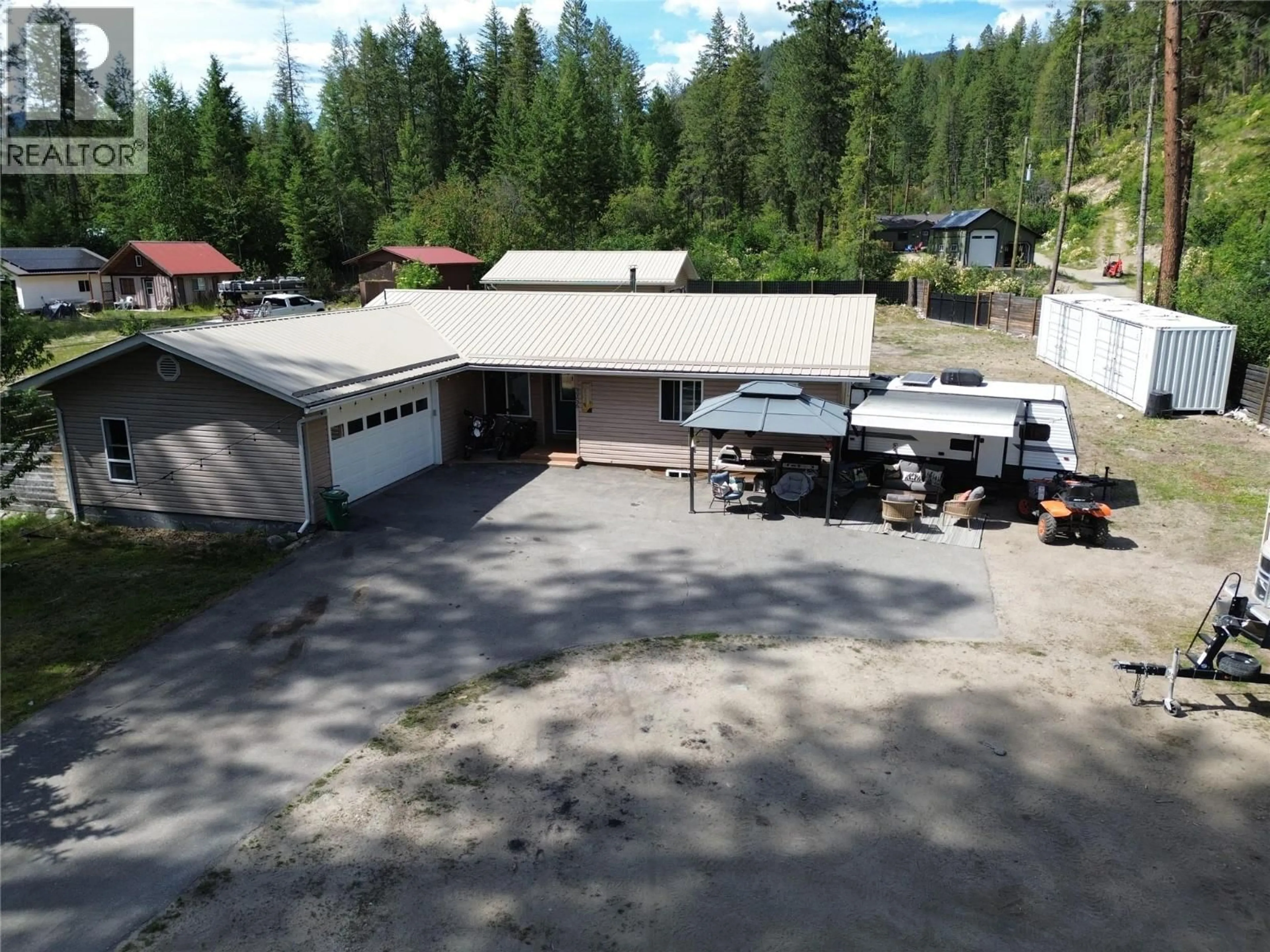 A pic from outside/outdoor area/front of a property/back of a property/a pic from drone, building for 3356 EAST LAKE DRIVE, Christina Lake British Columbia V0H1E1