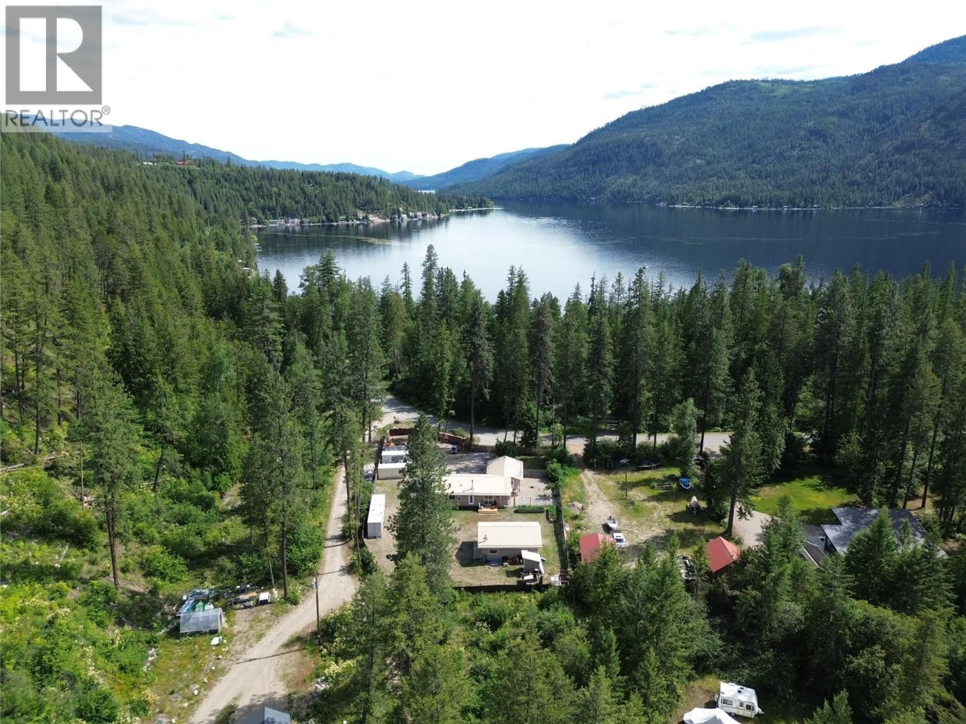 A pic from outside/outdoor area/front of a property/back of a property/a pic from drone, water/lake/river/ocean view for 3356 EAST LAKE DRIVE, Christina Lake British Columbia V0H1E1