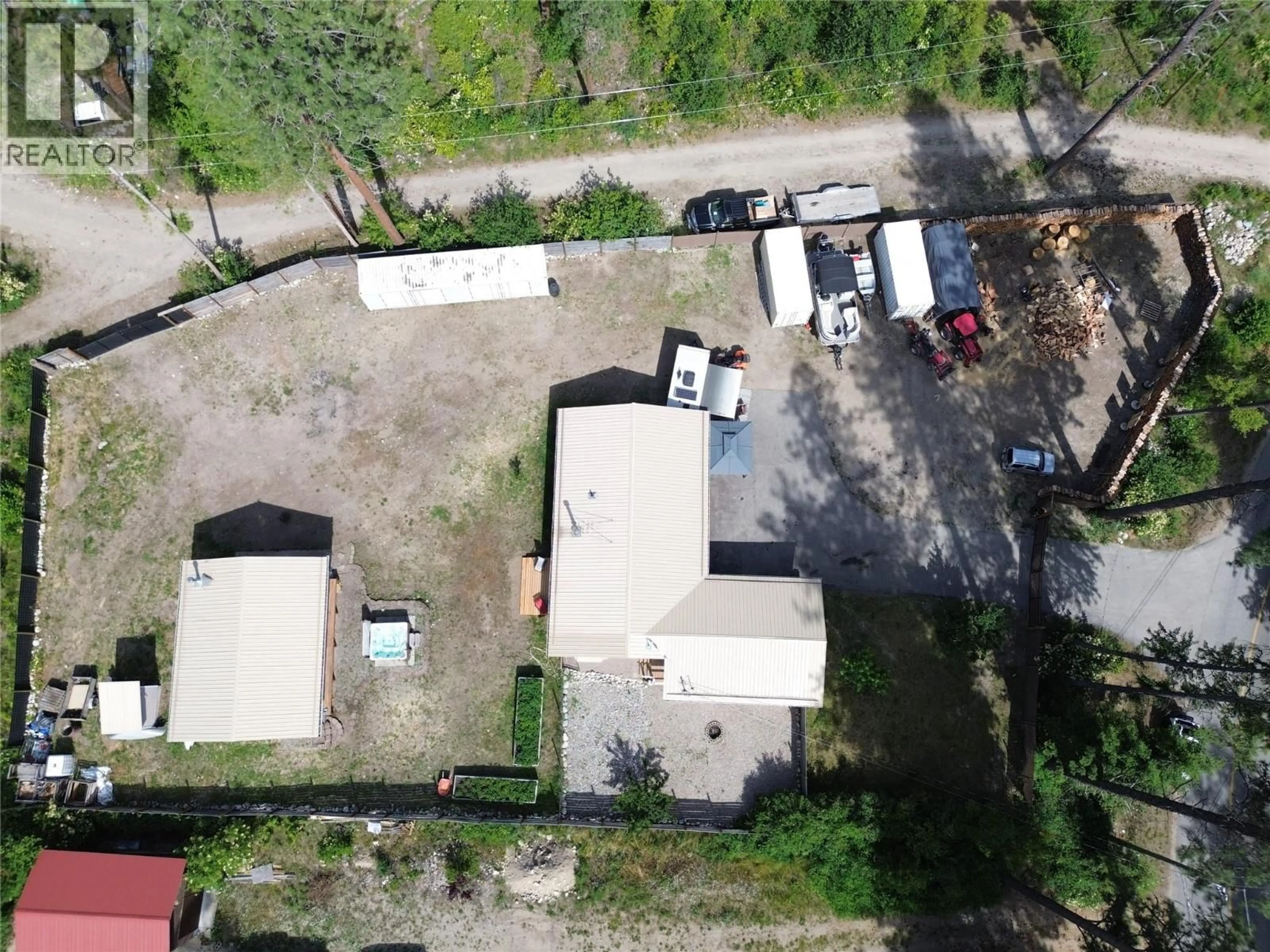 A pic from outside/outdoor area/front of a property/back of a property/a pic from drone, street for 3356 EAST LAKE DRIVE, Christina Lake British Columbia V0H1E1