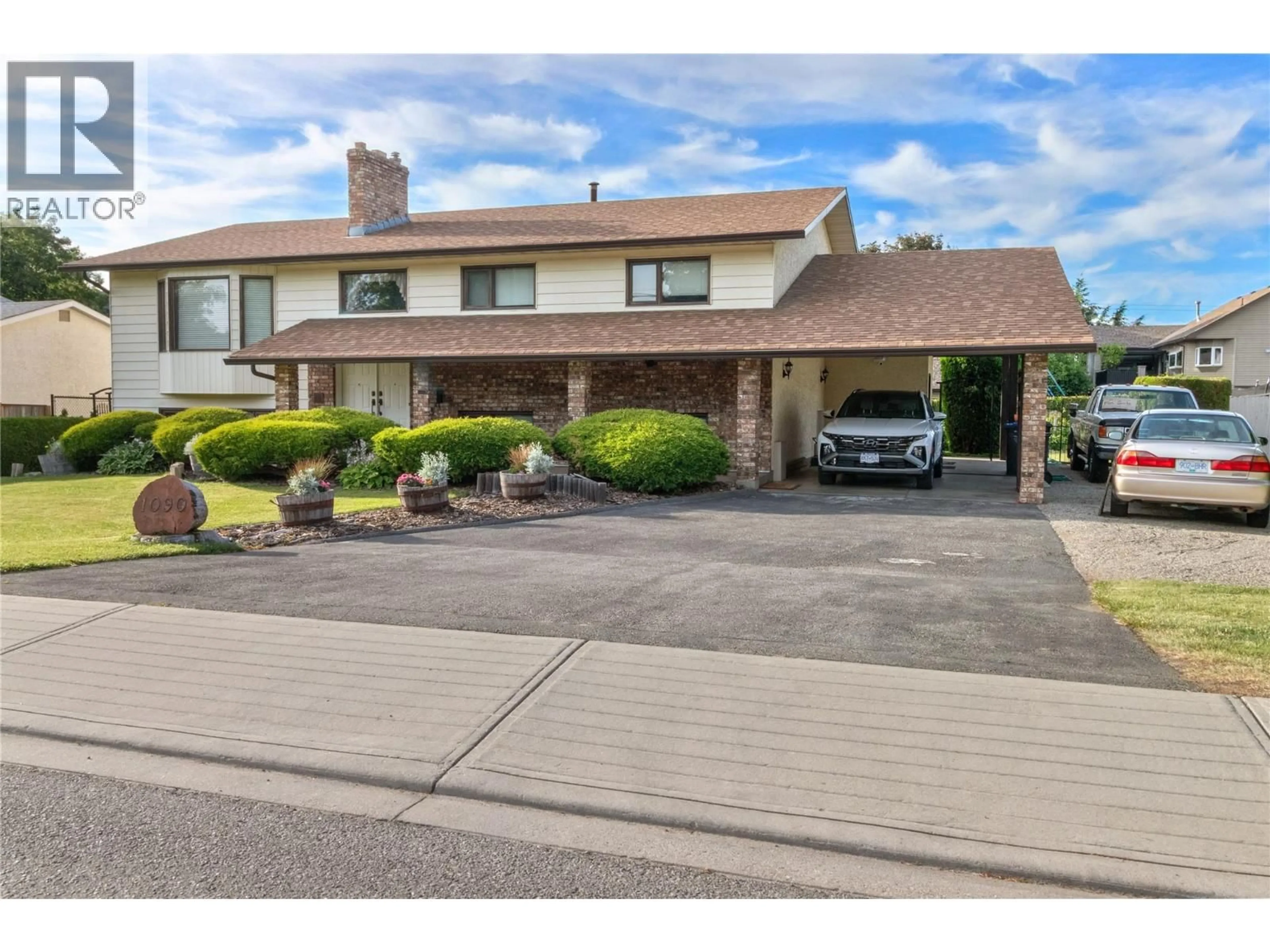 Home with brick exterior material, street for 1090 HOUGHTON ROAD, Kelowna British Columbia V1X6G8