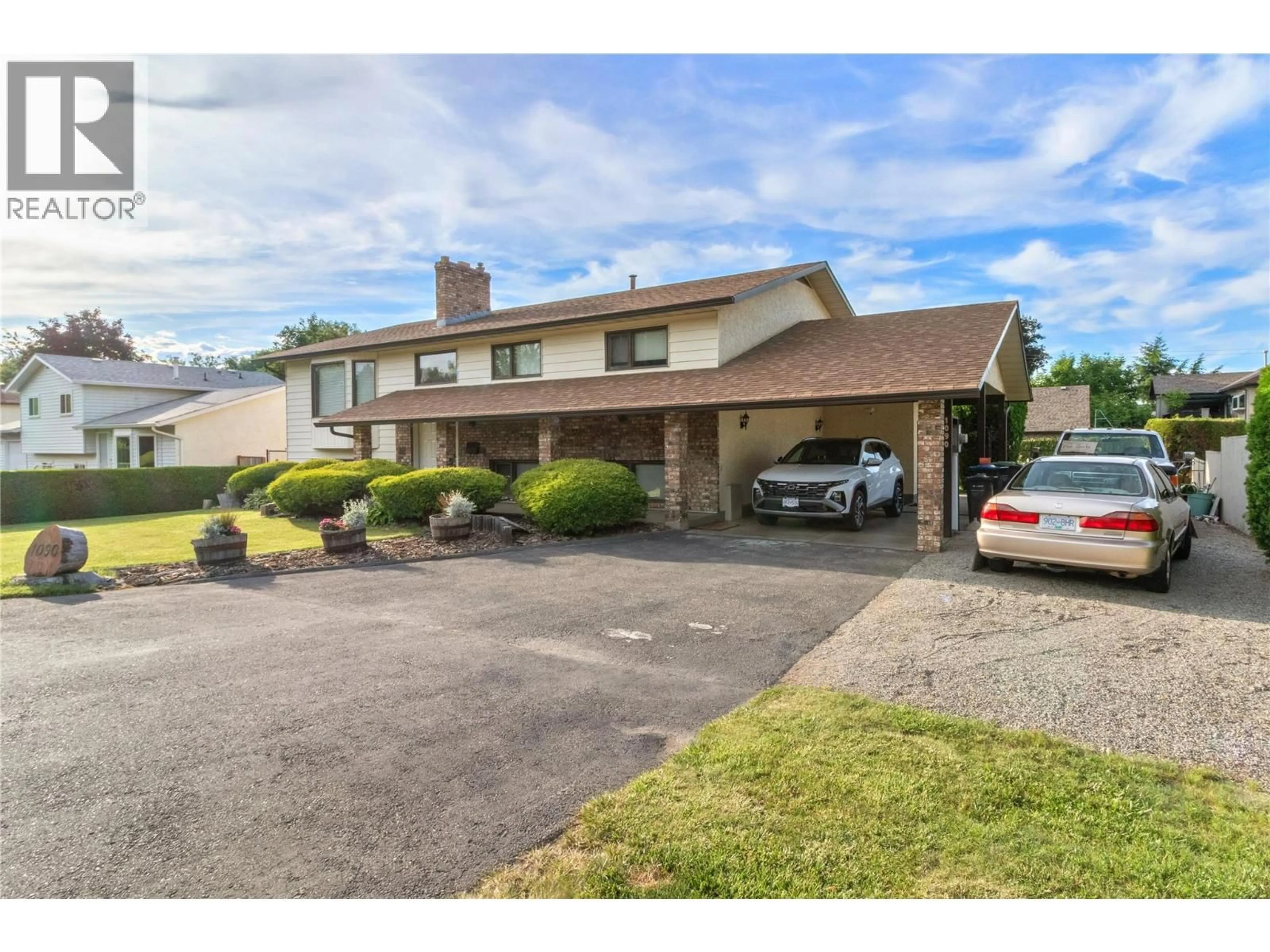 A pic from outside/outdoor area/front of a property/back of a property/a pic from drone, street for 1090 HOUGHTON ROAD, Kelowna British Columbia V1X6G8