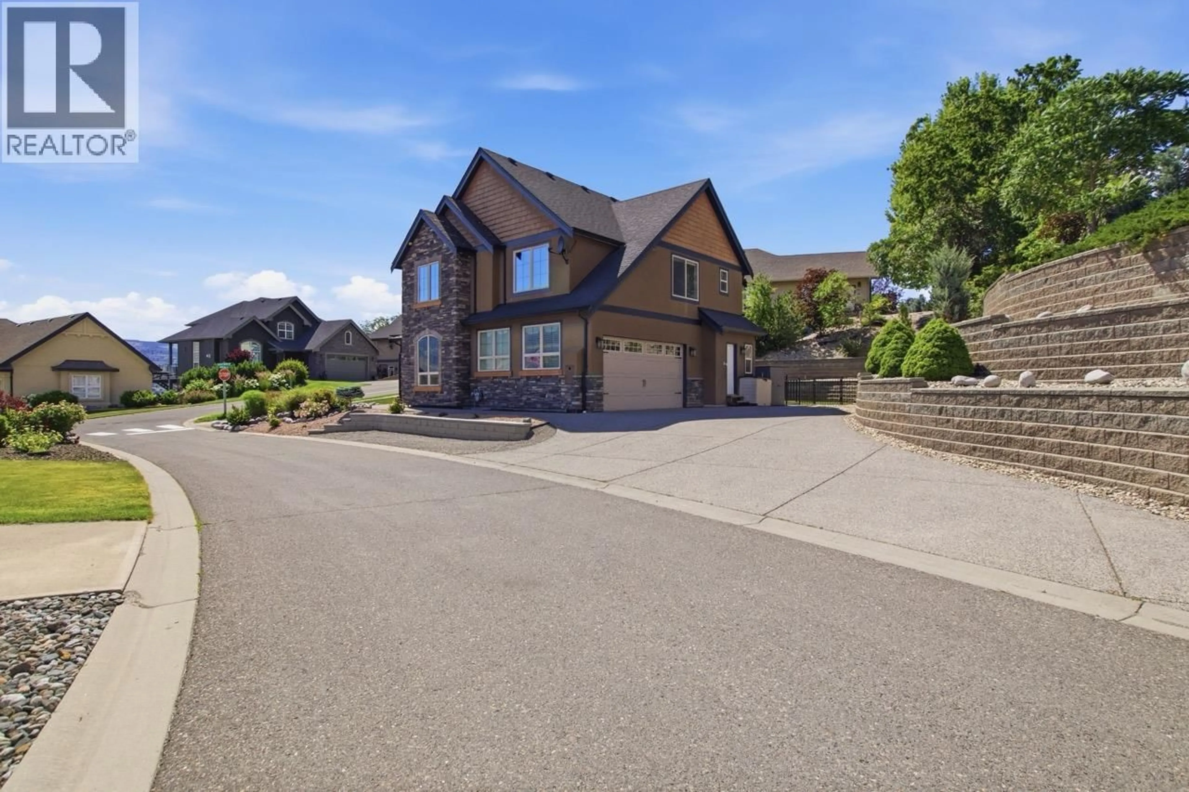 A pic from outside/outdoor area/front of a property/back of a property/a pic from drone, street for 1143 CANYON RIDGE DRIVE, Kamloops British Columbia V2H0A1