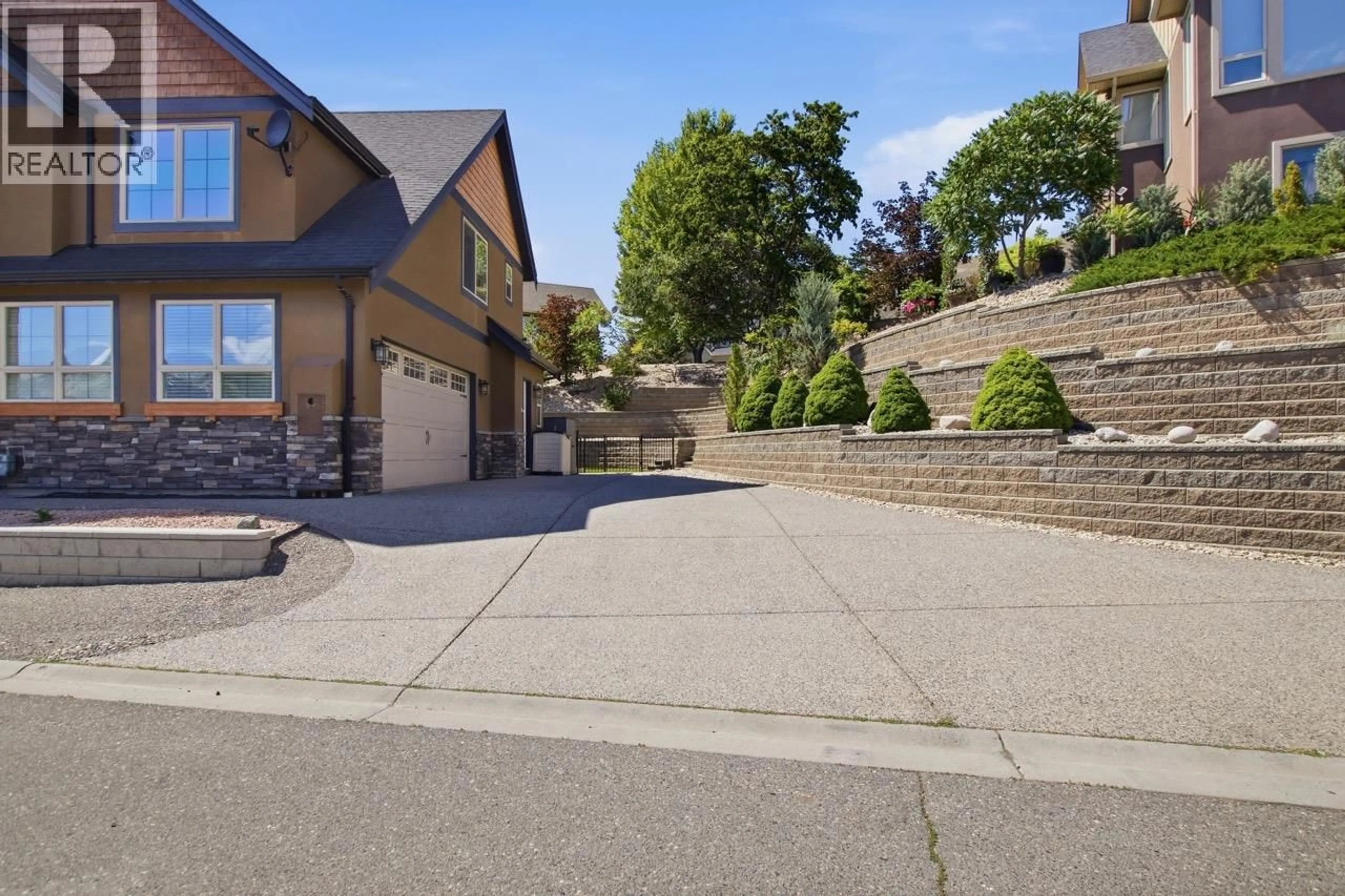 A pic from outside/outdoor area/front of a property/back of a property/a pic from drone, street for 1143 CANYON RIDGE DRIVE, Kamloops British Columbia V2H0A1