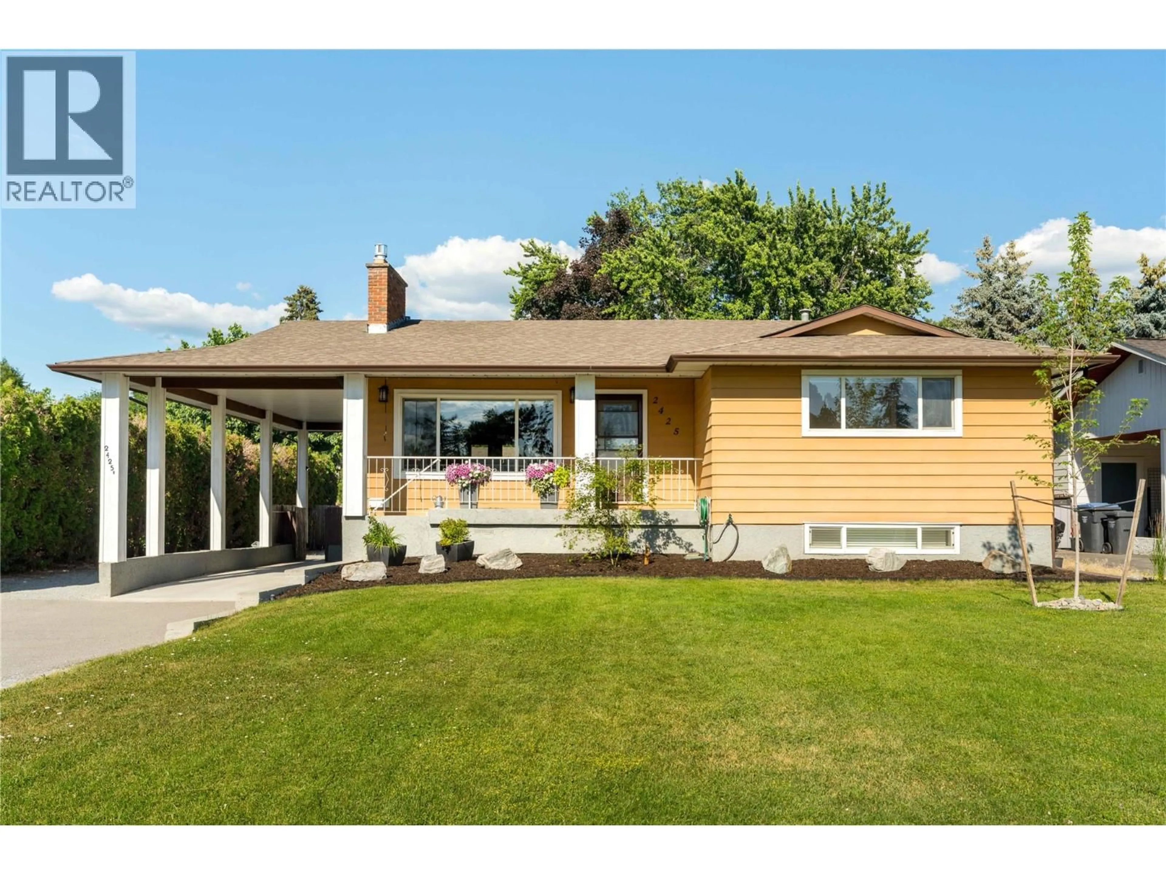 Home with vinyl exterior material, street for 2425 O'REILLY ROAD, Kelowna British Columbia V1W2V7