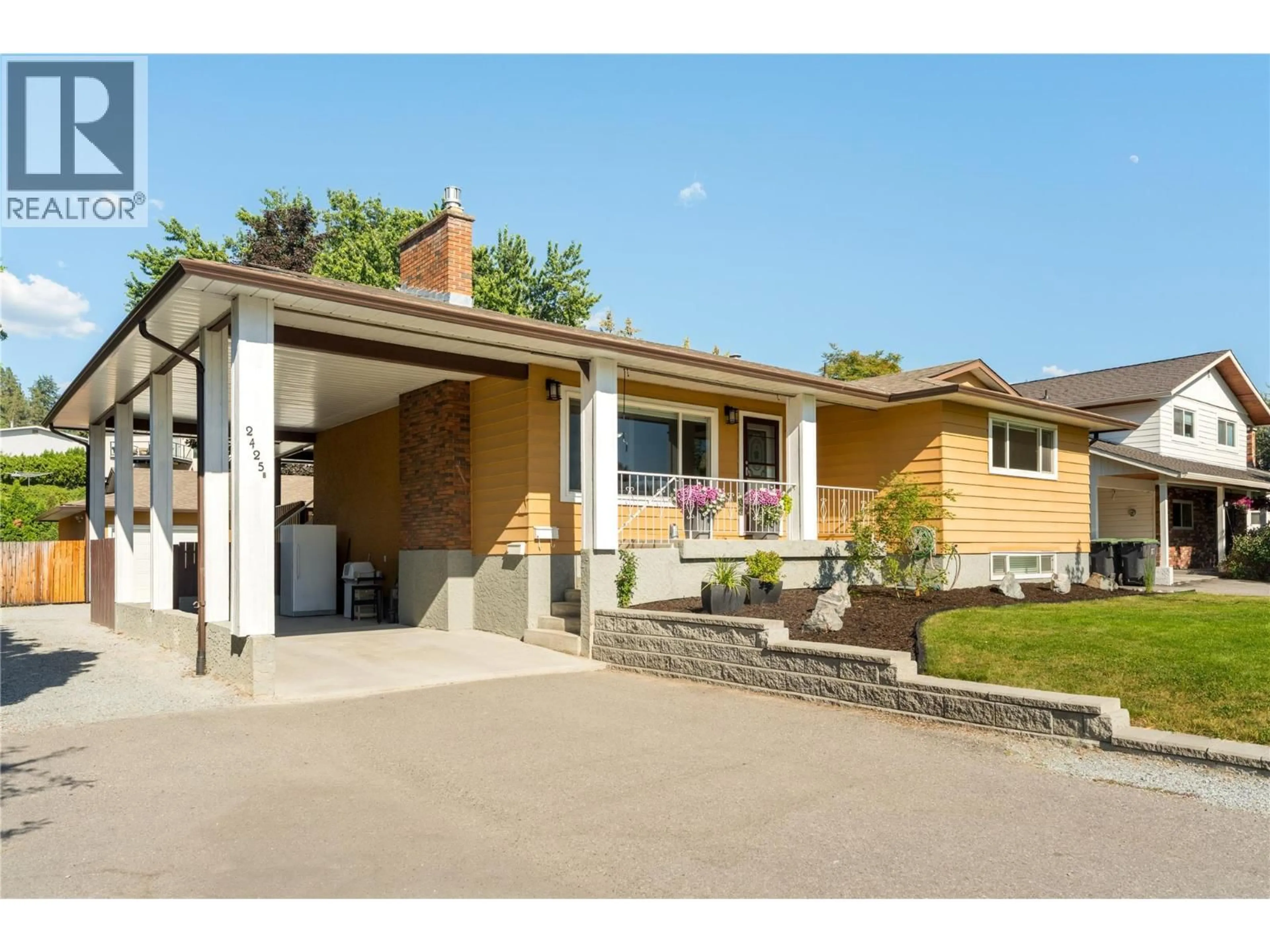 Home with vinyl exterior material, street for 2425 O'REILLY ROAD, Kelowna British Columbia V1W2V7
