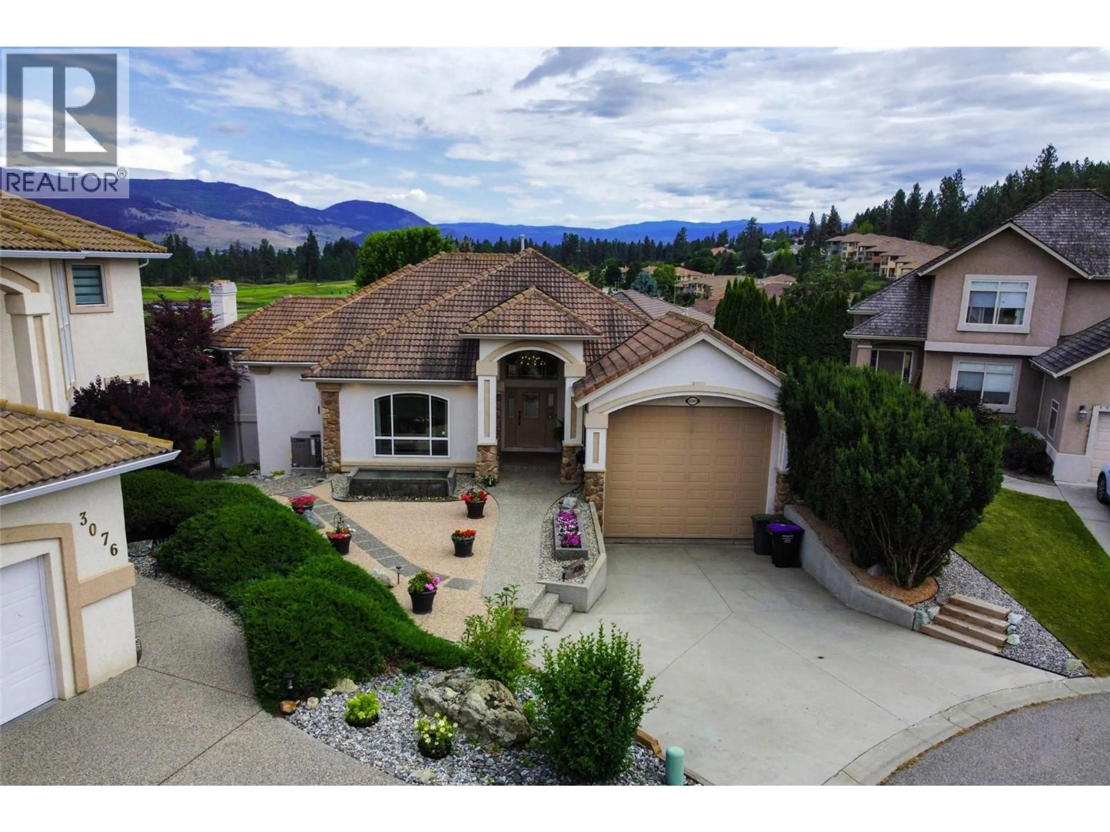 A pic from outside/outdoor area/front of a property/back of a property/a pic from drone, mountain view for 3080 QUAIL CRESCENT, Kelowna British Columbia V1V1Z9