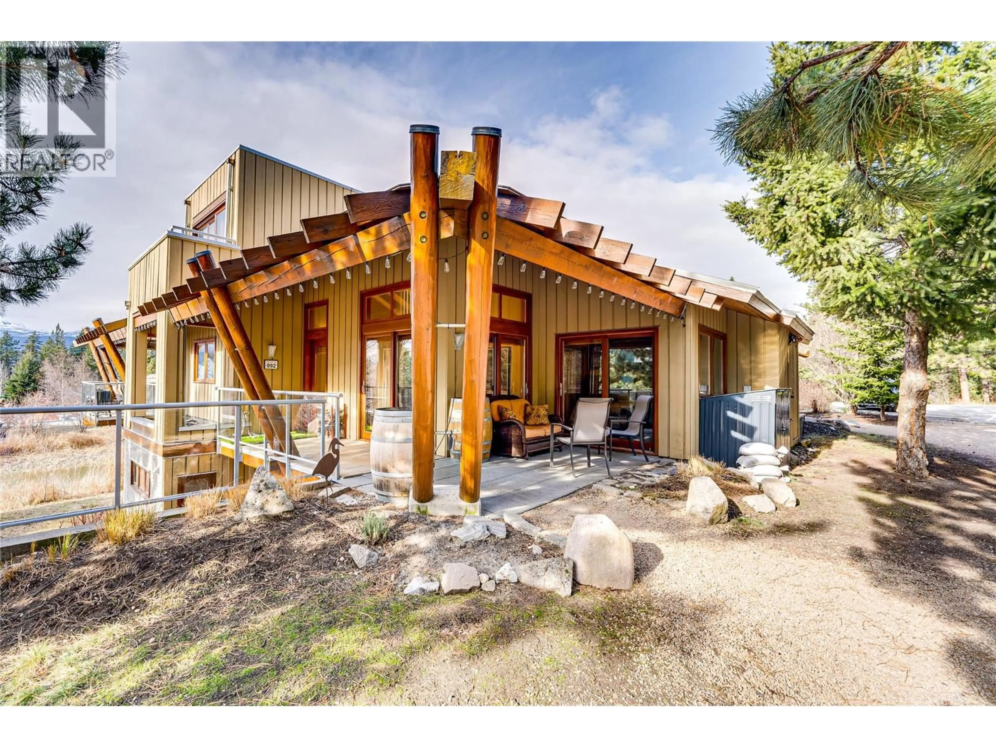 A pic from outside/outdoor area/front of a property/back of a property/a pic from drone, building for 92 - 9845 EASTSIDE ROAD, Vernon British Columbia V1H1Z2