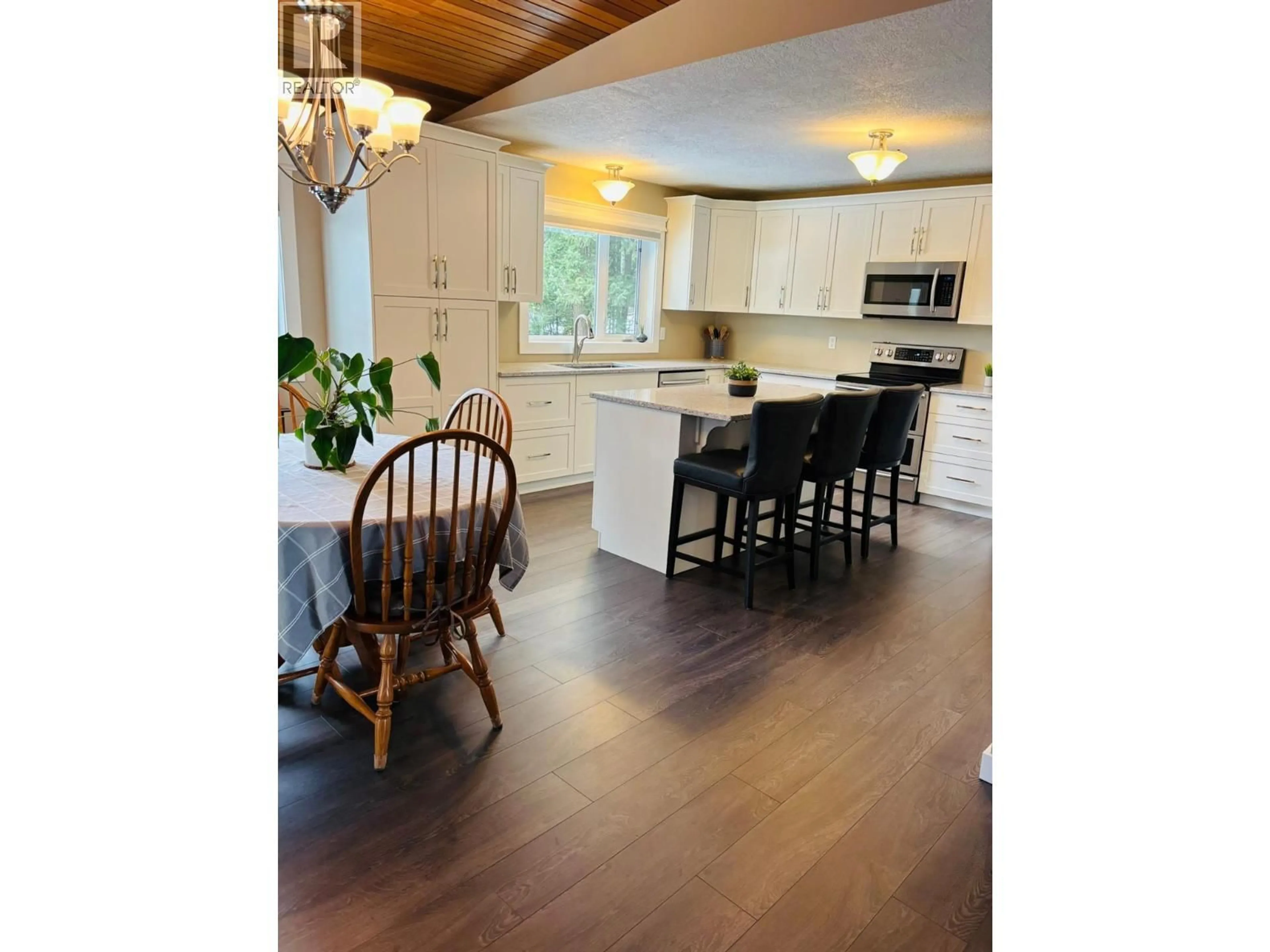 Open concept kitchen, wood/laminate floor for 610 10TH AVENUE NORTHWEST, Nakusp British Columbia V0G1R0