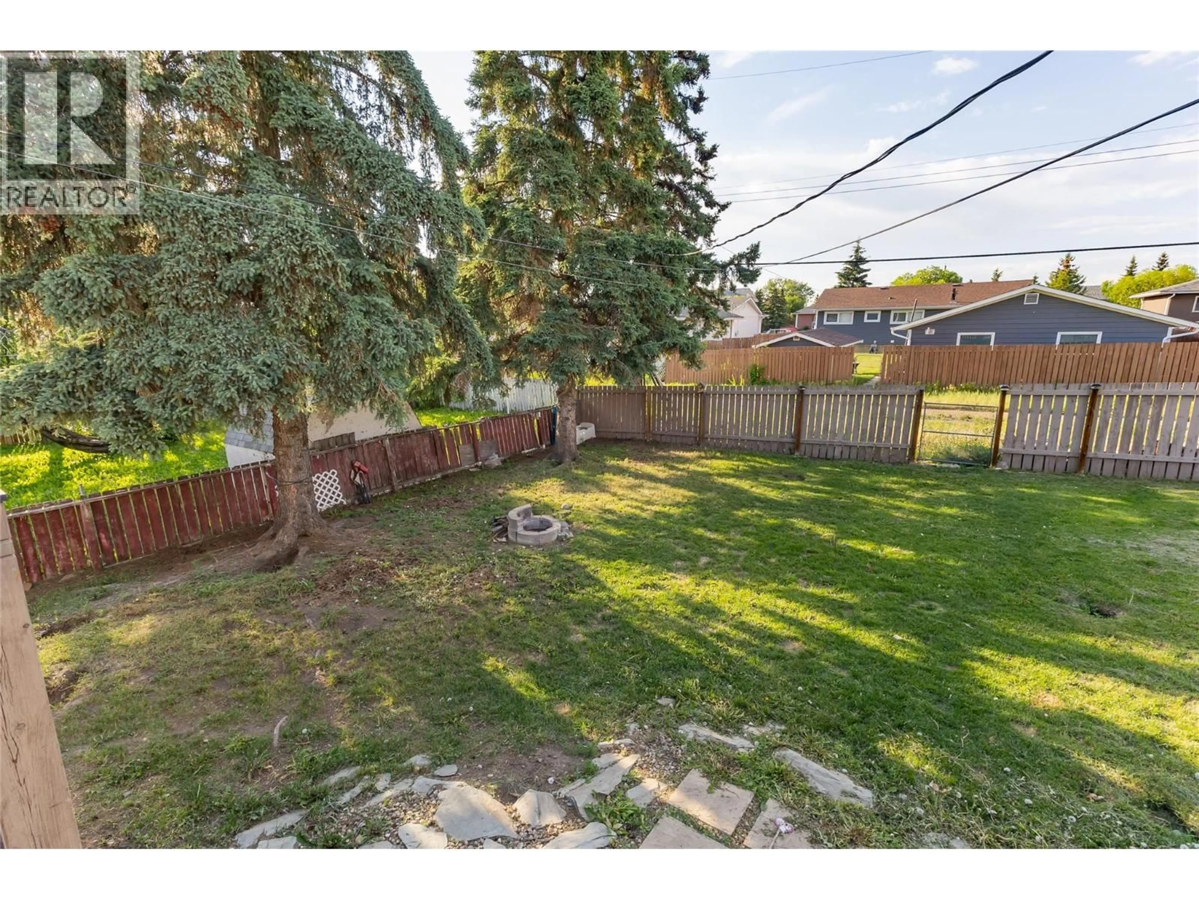 A pic from outside/outdoor area/front of a property/back of a property/a pic from drone, street for 416 96 AVENUE, Dawson Creek British Columbia V1G1K4